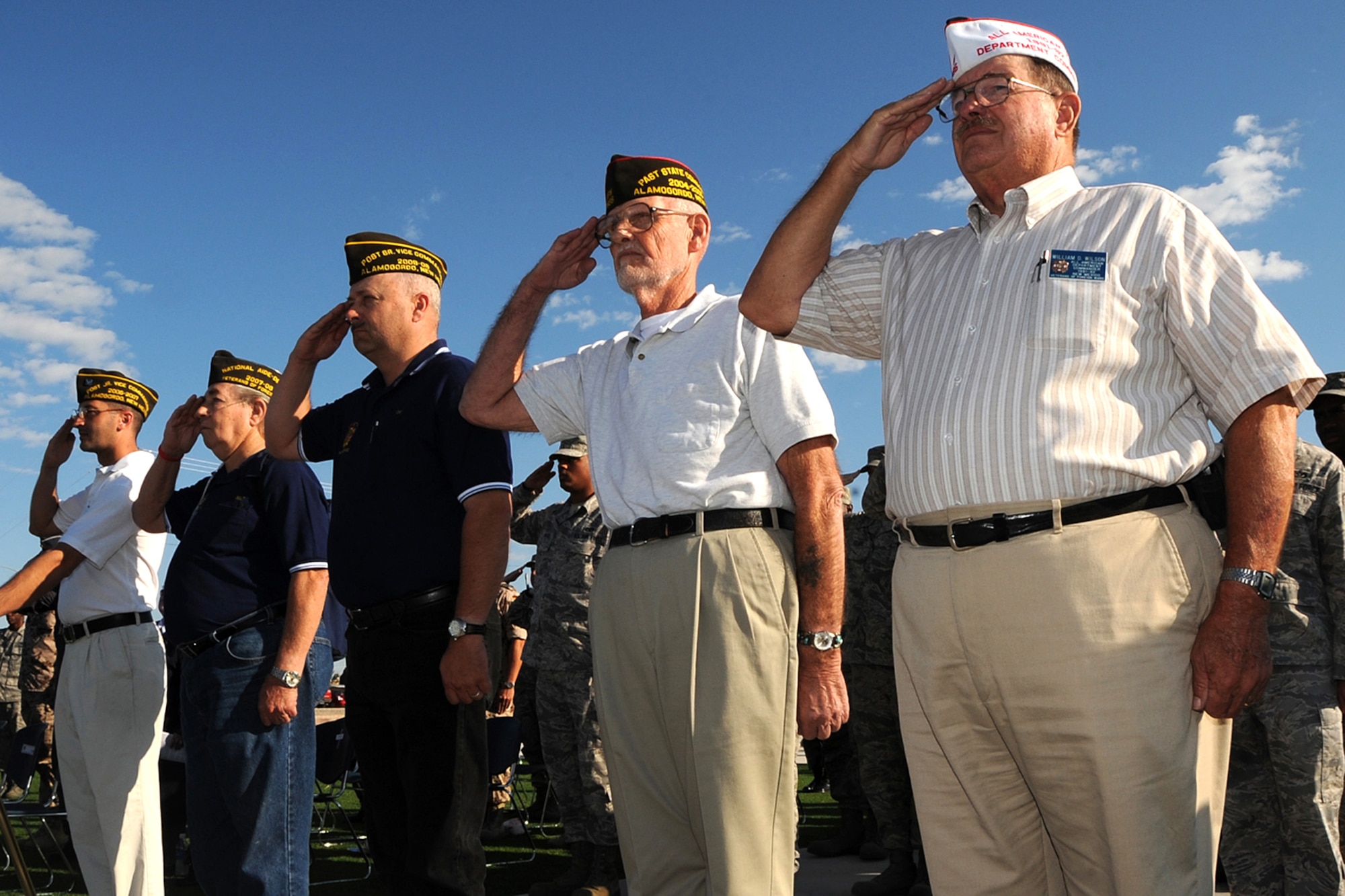 Members of the New Mexico division of the Veterans of Foreign Wars salute The Colors during the Prisoners of War/ Missing in Action Day ceremony held September 23 at Holloman AFB, N.M. (U.S. Air Force photo/ Staff Sgt. Chris Flahive)