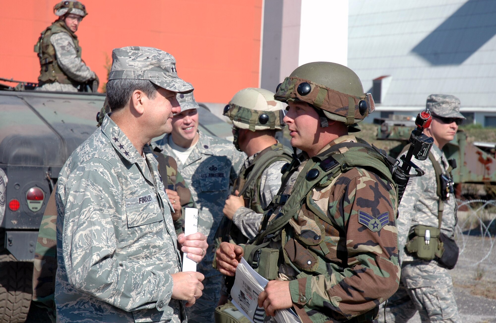 Lt. Gen. Vern "Rusty" Findley, Air Mobility Command vice commander, meets with Senior Airman Shaun Emery, from the 60th Air Mobility Wing Public Affairs, Travis Air Force Base, Calif,. during a tour of Air Force Exercise Eagle Flag 08-6 Sept. 23, 2008, at Naval Air Engineering Station Lakehurst, N.J.  General Findley visited McGuire Air Force Base, N.J., and the U.S. Air Force Expeditionary Center on Fort Dix, N.J., to learn more about expeditionary training and operations in both areas.  (U.S. Air Force Photo/Tech. Sgt. Scott T. Sturkol)