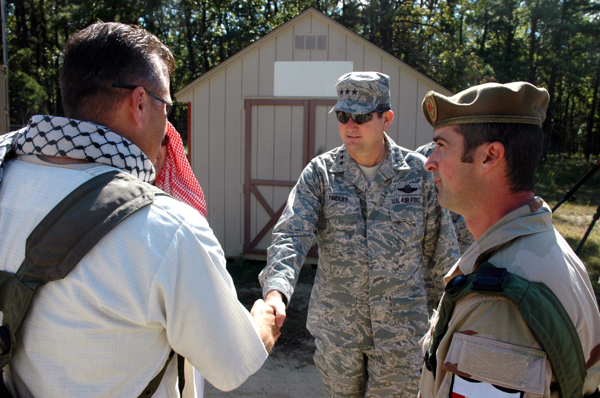 Lt. Gen. Vern "Rusty" Findley, Air Mobility Command vice commander, meets with exercise role players during a tour of Air Force Exercise Eagle Flag 08-6 Sept. 23, 2008, at Naval Air Engineering Station Lakehurst, N.J.  General Findley visited McGuire Air Force Base, N.J., and the U.S. Air Force Expeditionary Center on Fort Dix, N.J., to learn more about expeditionary training and operations in both areas.  (U.S. Air Force Photo/Tech. Sgt. Scott T. Sturkol)