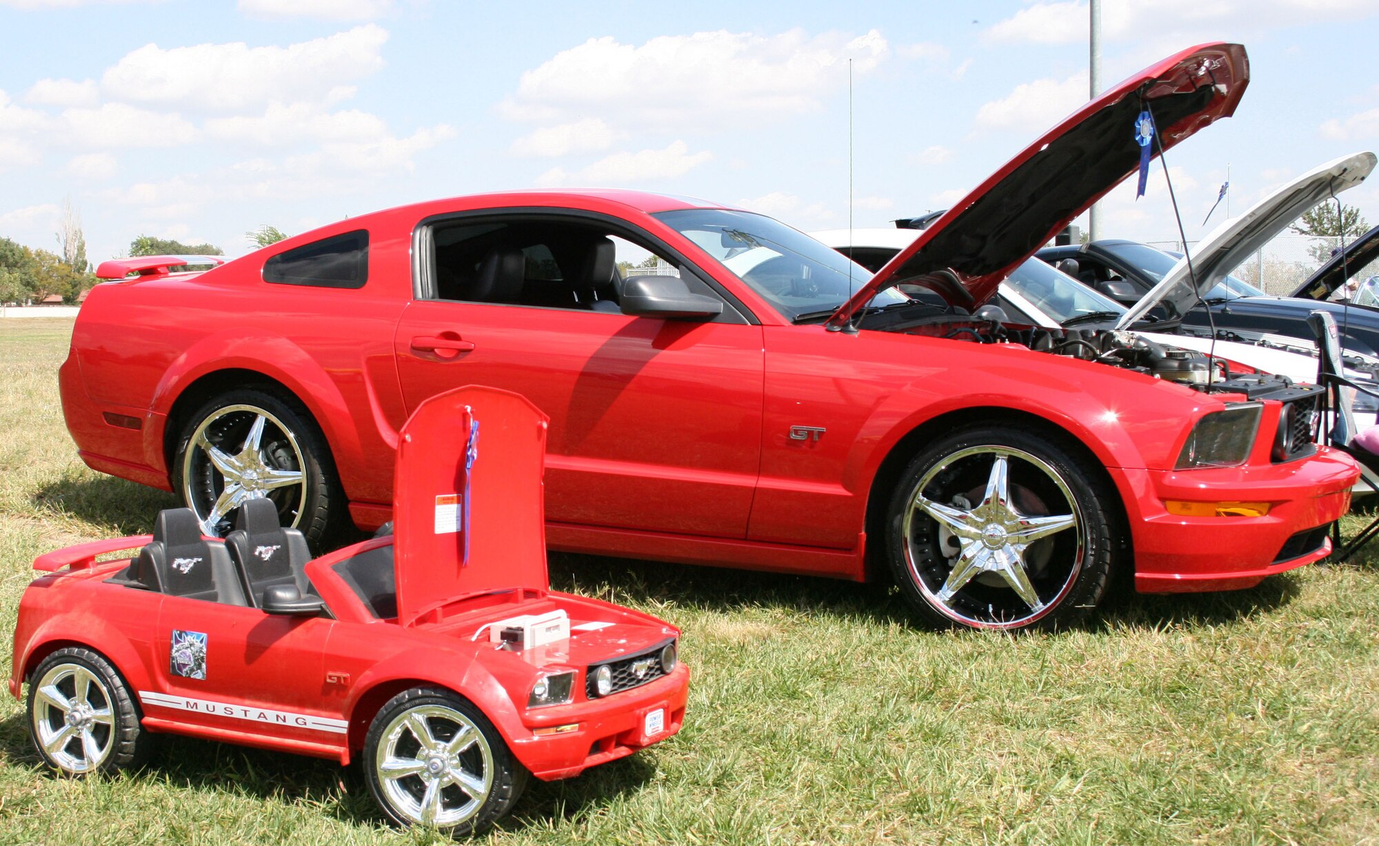 CANNON AIR FORCE BASE, N.M. - An electric Ford Mustang finds itself next to its gasoline-powered big brother at the Cannon Thunder Auto Show Sept. 20. The second annual auto show was held at Doc Stewart Park. (U.S. Air Force photo/Steve Lambert)