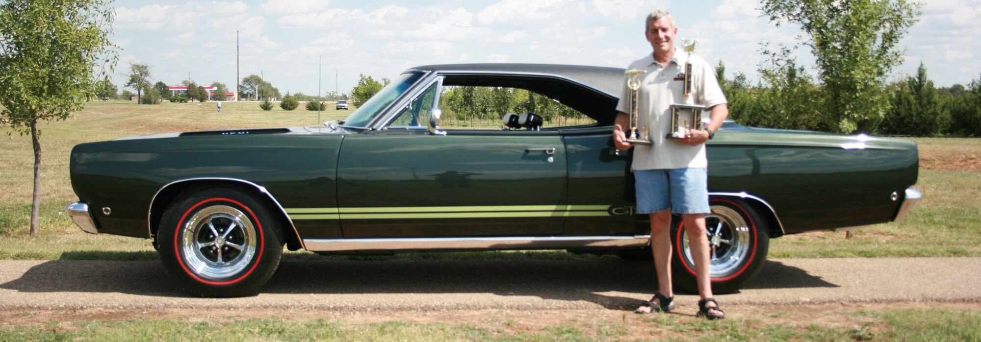 CANNON AIR FORCE BASE, N.M. - Graham King stands beside his 1968 Plymouth GTX that won best overall at the Cannon Thunder Auto Show Sept. 20. The second annual auto show was held at Doc Stewart Park. (U.S. Air Force photo/Steve Lambert)