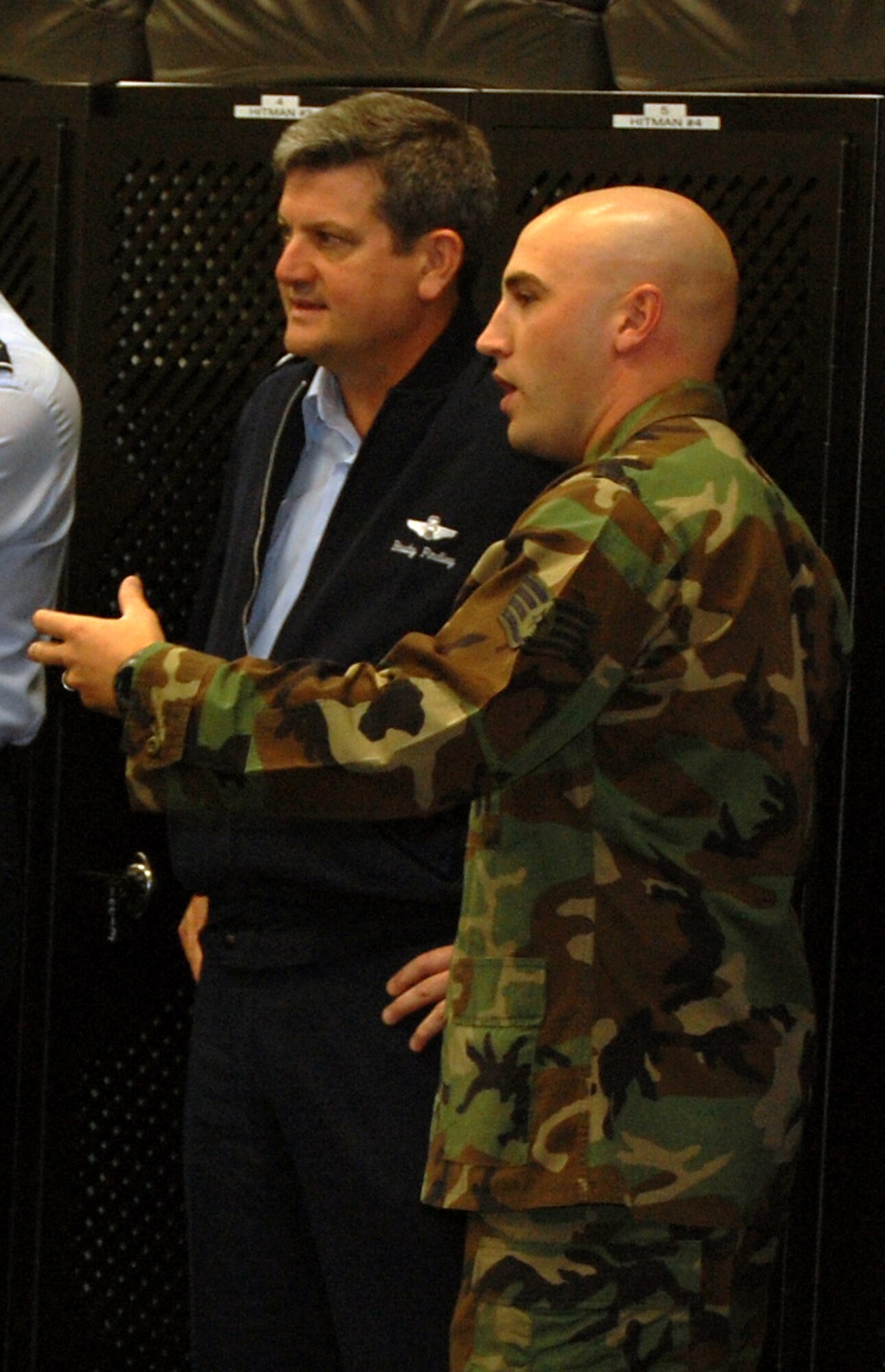 Staff Sgt. Anthony Richards, from the U.S. Air Force Expeditionary Center's 421st Combat Training Squadron, shows Lt. Gen. Vern "Rusty" Findley, Air Mobility Command vice commander, how students in the Phoenix Warrior Training Course practice "tape drills" during a tour of the USAF EC for General Findley Sept. 22, 2008, on Fort Dix, N.J.  General Findley visited the USAF EC for two days to learn about the unit's mission and capabilities.  (U.S. Air Force Photo/Tech. Sgt. Scott T. Sturkol)