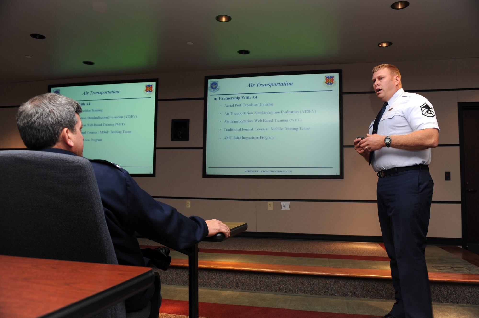Master Sgt. Jeff Norway, from the U.S. Air Force Expeditionary Center's Mobility Operations School Air Transportation Branch, provides Lt. Gen. Vern "Rusty" Findley, Air Mobility Command vice commander, a briefing on transporation career field courses during a tour of the USAF EC for General Findley Sept. 22, 2008, on Fort Dix, N.J.  General Findley visited the USAF EC for two days to learn about the unit's mission and capabilities.  (U.S. Air Force Photo/Staff Sgt. Nathan Bevier)