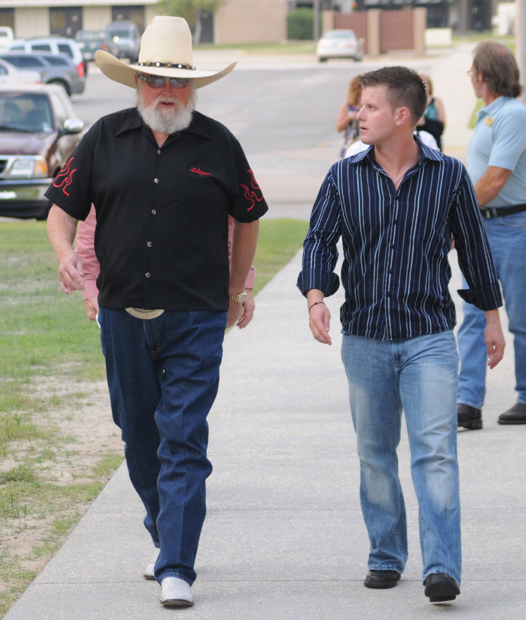 Left, Charlie Daniels and his godson 2nd Lt. Logan Smith, 81 CES, spend some time together at a pre-concert reception where Mr. Daniels met with base leadership, local community members and several Keesler Airmen who earned Bronze Stars for their actions in Iraq.  The Charlie Daniels Band performed for Keesler Air Force Base Airmen, families and local community members Sept. 18 to help celebrate the Air Force's 61st birthday.  (U.S. Air Force photo by Kemberly Groue)