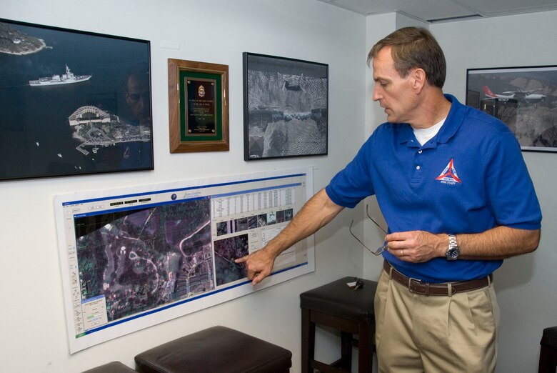 John Salvador, Civil Air Patrol's director of operations, describes the image capabilities of the Airborne Real-Time Cueing Hyperspectral Enhanced Reconnaissance system at the CAP National Operations Center here Sept. 16. The system is used to conduct aerial surveys for rescue missions. (Air Force photo by Jamie Pitcher)