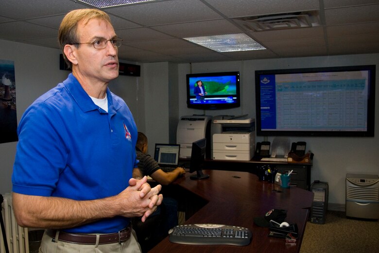 John Salvador, Civil Air Patrol's director of operations, explains the capabilities of the CAP National Operations Center here Sept. 16. The center is CAP's communication hub during disaster relief operations. (Air Force photo by Jamie Pitcher)