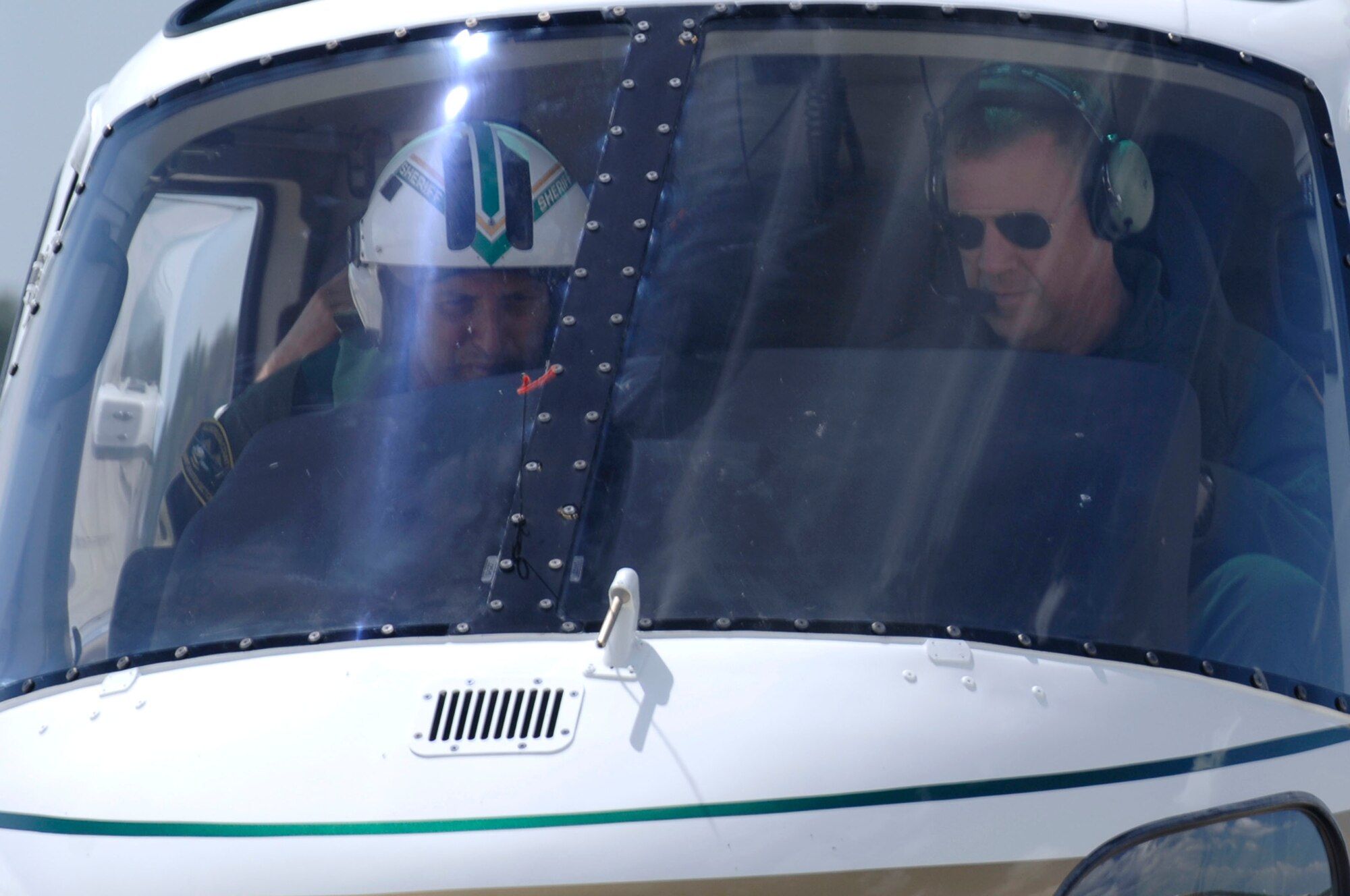 6 AMW Commander Colonel Larry Martin recieves a ride in a Hillsborough County Sheriff's Aviation Section helicopter piloted by Kevin Langiotti at MacDill AFB on September 23, 2008.  The Hillsborough County Sherriff's department was giving Colonel Martin an aerial tour of the base..

(U.S. Air Force Photo by Staff Sergeant Joseph L. Swafford Jr.) (Released)
