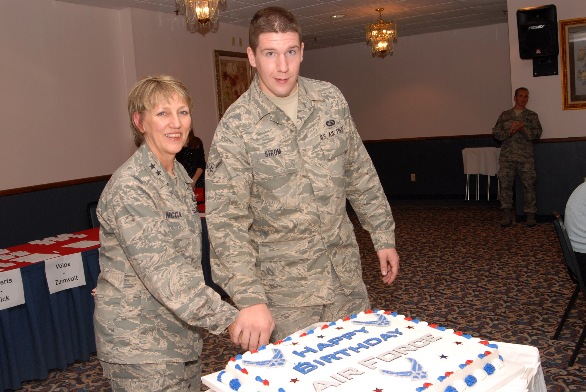 Maj. Gen. K. C. McClain, Air Force Personnel Center commander, Randolph Air Force Base, Texas, and Airman Dylan Strom, 314th Communications Squadron, cut a cake during the Air Force Birthday at Little Rock AFB on September 18, 2008. (U. S. Air Force photo by Airman 1st Class Jim Araos)