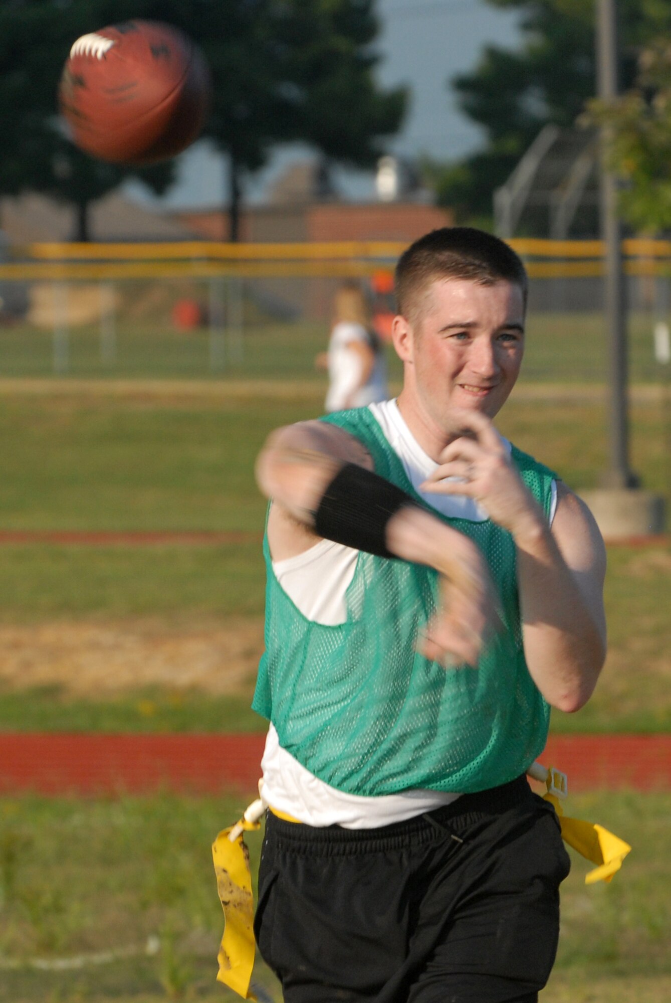 Senior Airman Bryan Thomas, 41st Airlift Squadron, delivers a pass during a flag football game on Little Rock AFB Sept. 23. (U.S. Air Force photo by Airman 1st Class Jim Araos)