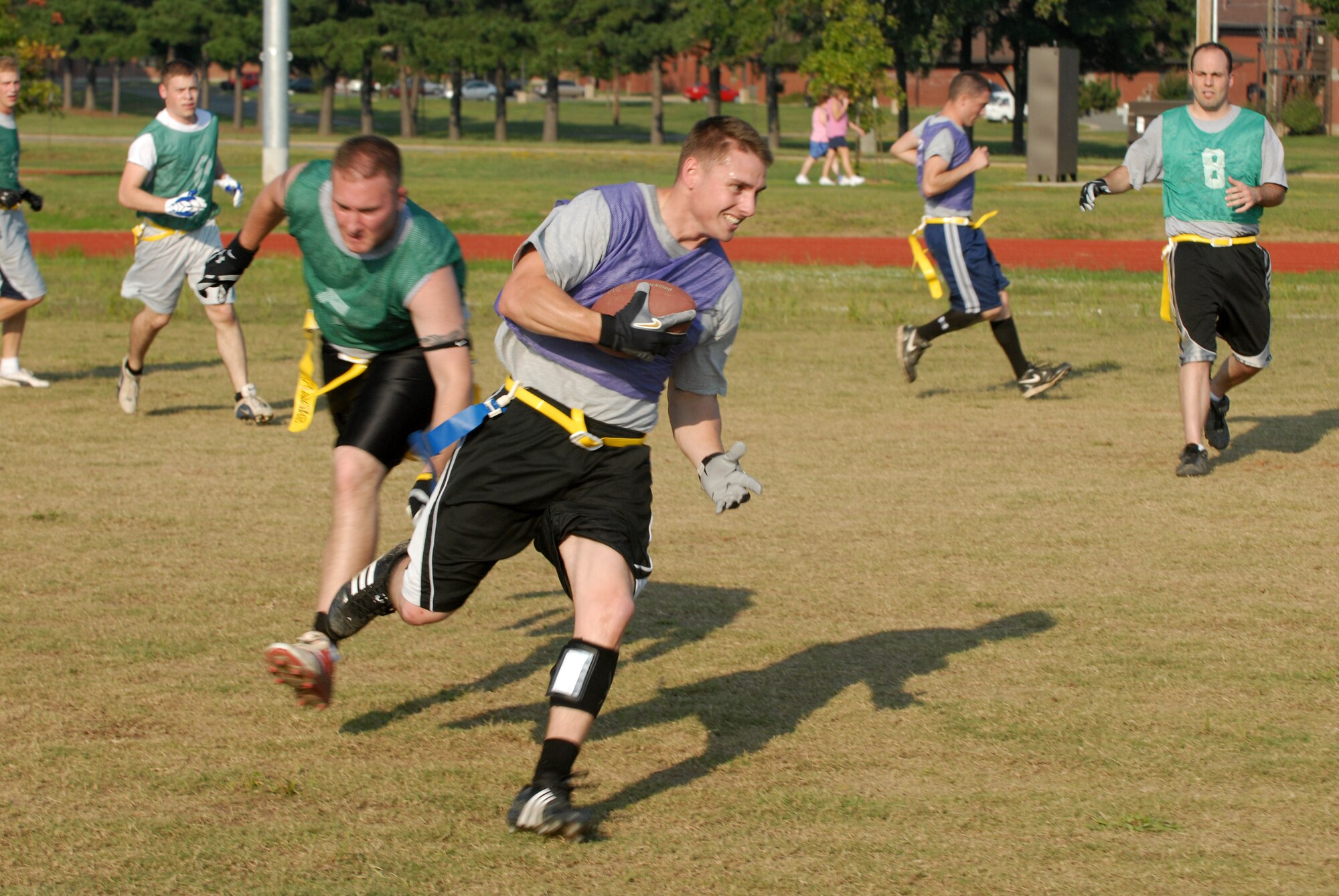Airman 1st Class William Boatwright, 314th Logistic Readiness Squadron, runs the football during a flag football game on Little Rock AFB Sept. 23. (U.S. Air Force photo by Airman 1st Class Jim Araos)