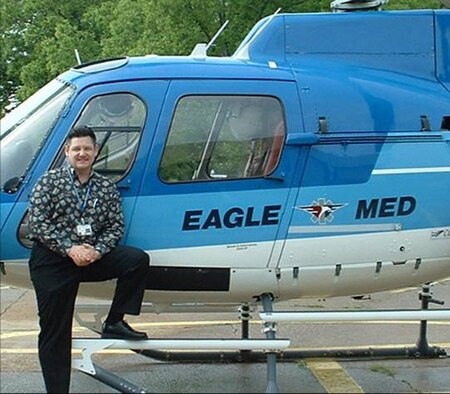 Maj. Mark Rogers, a senior hospital administrator with the 507th Medical Squadron poses beside an air ambulance while working at his civilian job as the Chief Executive Officer of the Pushmataha Hospital in Antlers, Oklahoma.  The Air Force reservist was recently selected to serve on an Oklahoma State Health Care Commission.