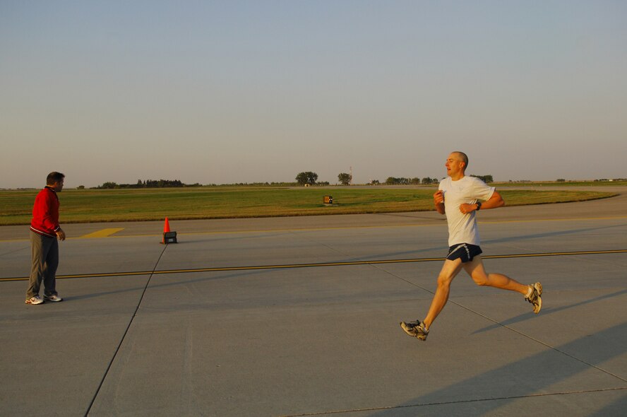 MINOT AIR FORCE BASE, N.D. – Staff Sgt. Thomas Dow, 5th Bomb Wing public affairs, finishes the 1.5 mile Taxiway Echo Fitness Run here Sept. 19. Sergeant Dow finished first in his group with a run-time of 8 minutes, 35 seconds. The fastest runner of the day was Airman 1st Class Matthew Beers, 5th Civil Engineer Squadron structural apprentice, with a run-time of 8 minutes, 5 seconds. (U.S. Air Force photo by Senior Airman Cassandra Jones)