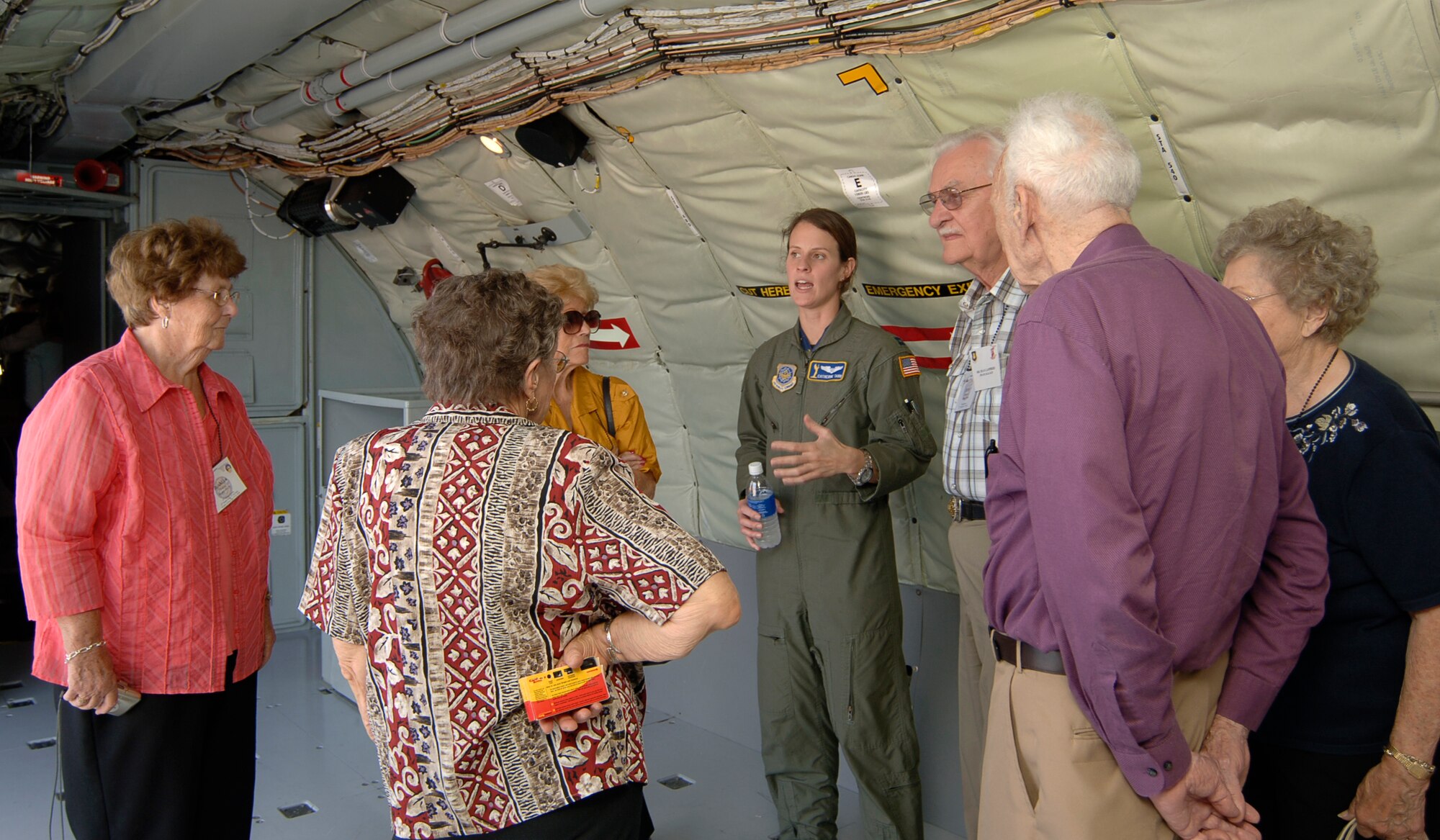 MCCONNELL AIR FORCE BASE, Kan. -- Capt. Catherine Tabb, 22nd Air Refueling Wing, answers questions from 22nd Bombardment Group members and their spouses inside a KC-135 Stratotanker, Sept. 19. These veterans, active during 1940 through 1945 under 5th Air Force and with them began the motto DUCEMUS, “We Lead.” (Photo by Airman 1st Class Maria Ruiz)