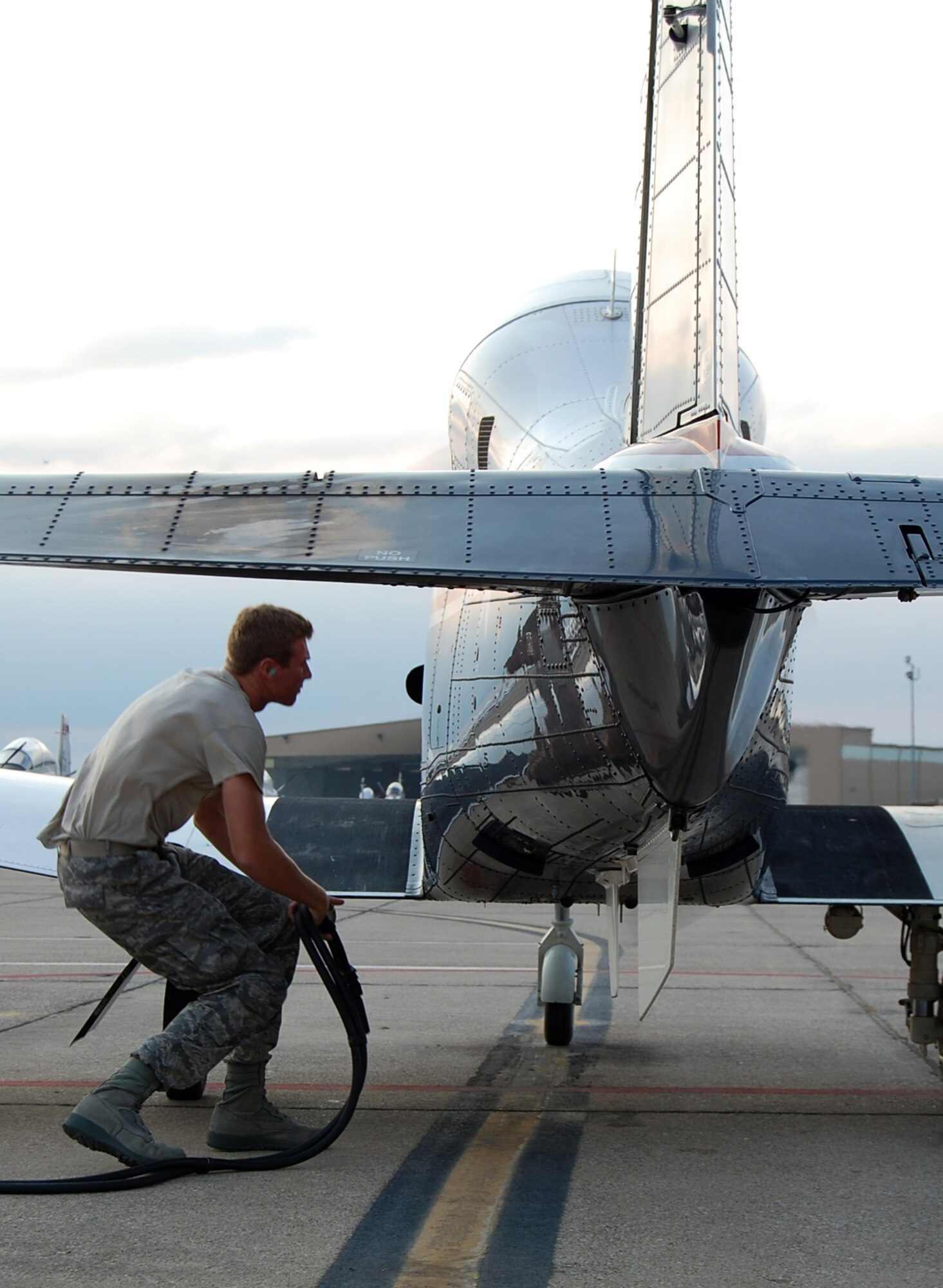 LAUGHLIN AIR FORCE BASE, Texas—2nd Lt. Kevin Hawkins, 47th Operation Support Squadron, cautiously backs away from a T-6 Texan II after removing its auxiliary power.  Lieutenant Hawkins is one of the many United States Air Force Academy graduates stationed at Laughlin who have been tasked to perform various jobs while waiting for their Specialized Undergraduate Pilot Training to start. He is currently acting as a T-6 A-Cell crew chief for his casual status job. (U.S. Air Force photo by 2nd Lt. Cody Chiles)