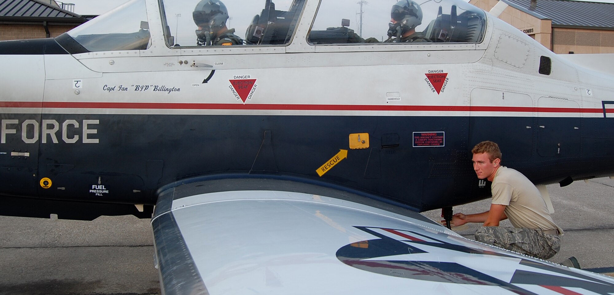 LAUGHLIN AIR FORCE BASE, Texas—2nd Lt. Kevin Hawkins, 47th Operation Support Squadron, connects auxiliary power to a T-6 Texan II while he performs his casual status job as a crew chief. (U.S. Air Force photo by 2nd Lt. Cody Chiles)