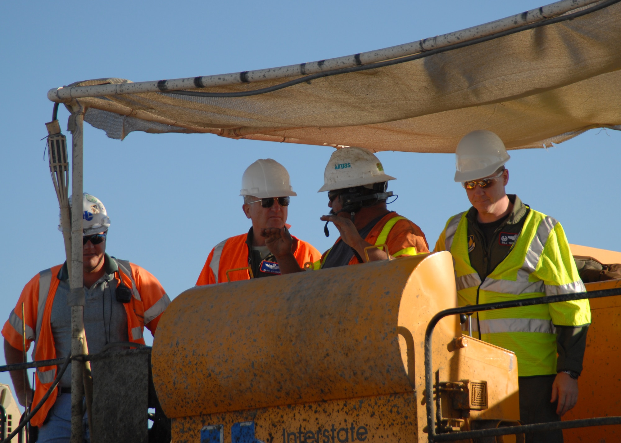 Maj. Gen. David Eichhorn (second from left), Air Force Flight Test Center commander, receives an explanation of what was done to finish the runway early from a member of the 95th Civil Engineering Transportation Directorate. The cost of the construction for the 15,000-foot runway was $118 million. Team Edwards’ senior leadership went out to the main runway to assist in the paving of the final portion Sept. 19.( Air Force photo by Airman 1st Class William O'Brien)