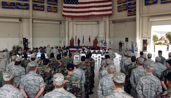 Team Charleston Airmen stand in formation as Col. John "Red" Millander shares a personal story about POWs and the importance of remembering their sacrifice during the POW/MIA retreat ceremony at Charleston AFB Sept. 24. Charleston AFB commemorated their brothers in arms who had become prisoners of war or were declared missing in action during a time of war. (U.S. Air Force photo/Airman 1st Class Timothy Taylor)