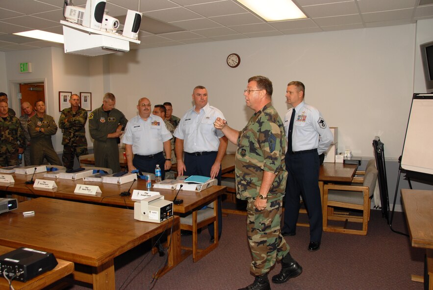 Command Chief Craig Wheeler addresses the Satellite Non-Commission Officer Academy class at the 175th Wing in Baltimore Maryland.  This is the first night of an eleven week on-base study before attending a two week in-resident program at McGhee Tyson ANGB, TN  (U.S. Air Force Photo by Master Sgt. Ed Bard) 
 
