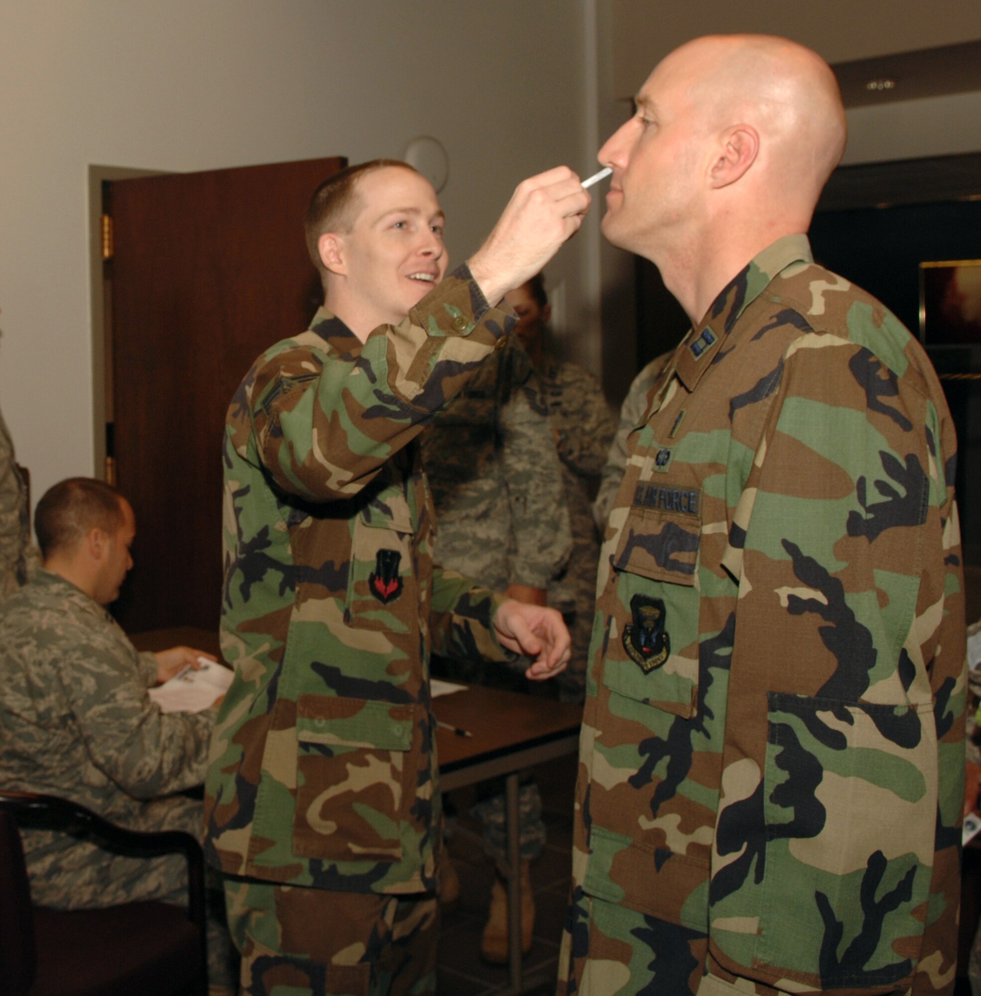 WHITEMAN AIR FORCE BASE, Mo. – Ch. (Capt.) Curt Cizek, 509th  Bomb Wing Chapel, receives a FluMist vaccination from Tech. Sgt. Kenneth Norris, 509th Medical Operations Squadron, Sept. 24. Active duty members are required to receive either the FluMist or a flu shot. For more information, call the immunizations clinic at 687-4304.(U.S. Air Force photo/Senior Airman Jessica Snow) 