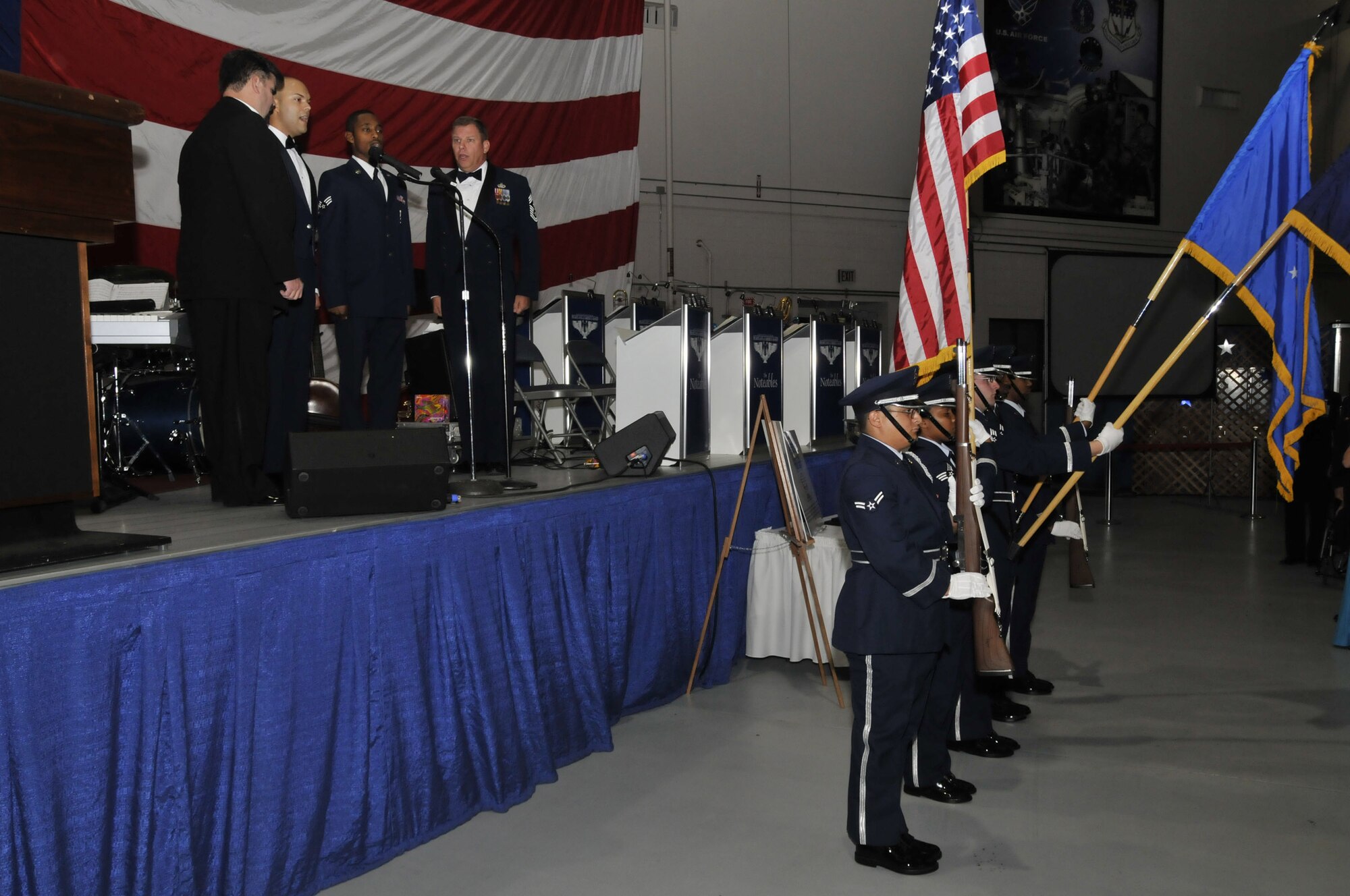 Members of Team Malmstrom sing the National Anthem while the Honor Guard presents the Colors at the Air Force Ball Sept. 20. (U.S. Air Force photo/John Turner)