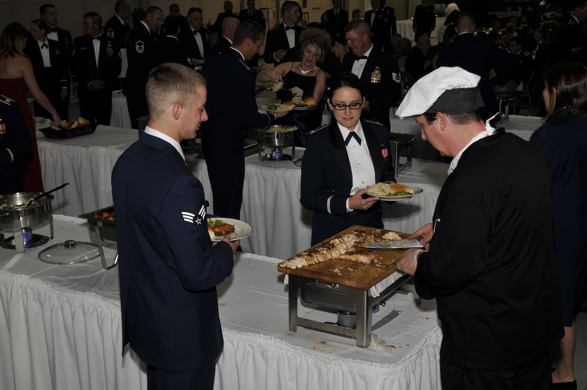 Members of Team Malmstrom make their way through the buffet line at the Air Force Ball Sept. 20 at the 3-Bay hangar. Dinner was catered by Golden Corral. (U.S. Air Force photo/John Turner)