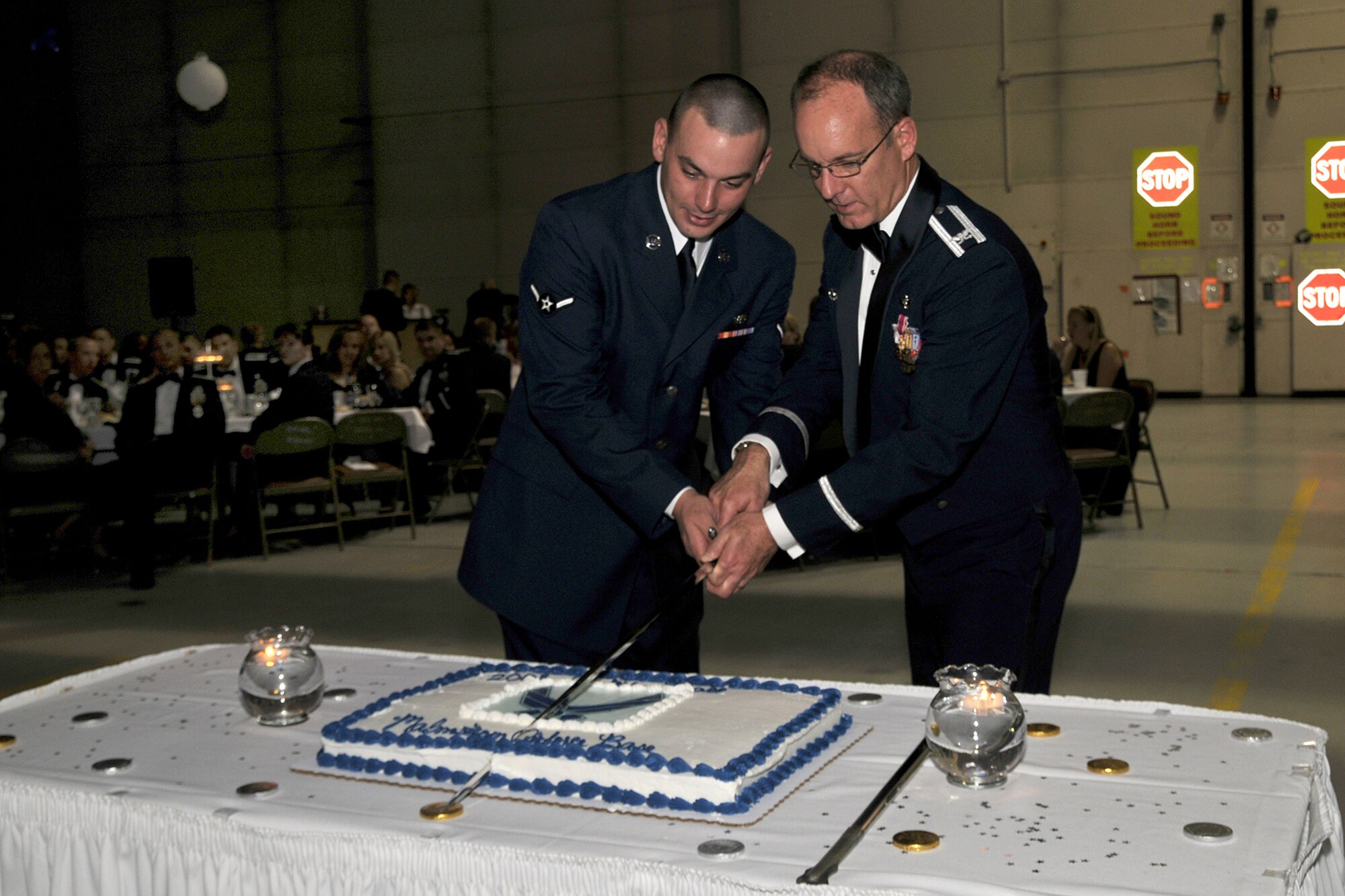 Airman Kevin Mahoney, 341st Force Support Squadron fitness specialist, and Col. Michael Fortney, 341st Missile Wing commander, cut the cake at the Air Force Ball Sept. 20. Airman Mahoney was the youngest member of Team Malmstrom at the time of the event. (U.S. Air Force photo/John Turner)