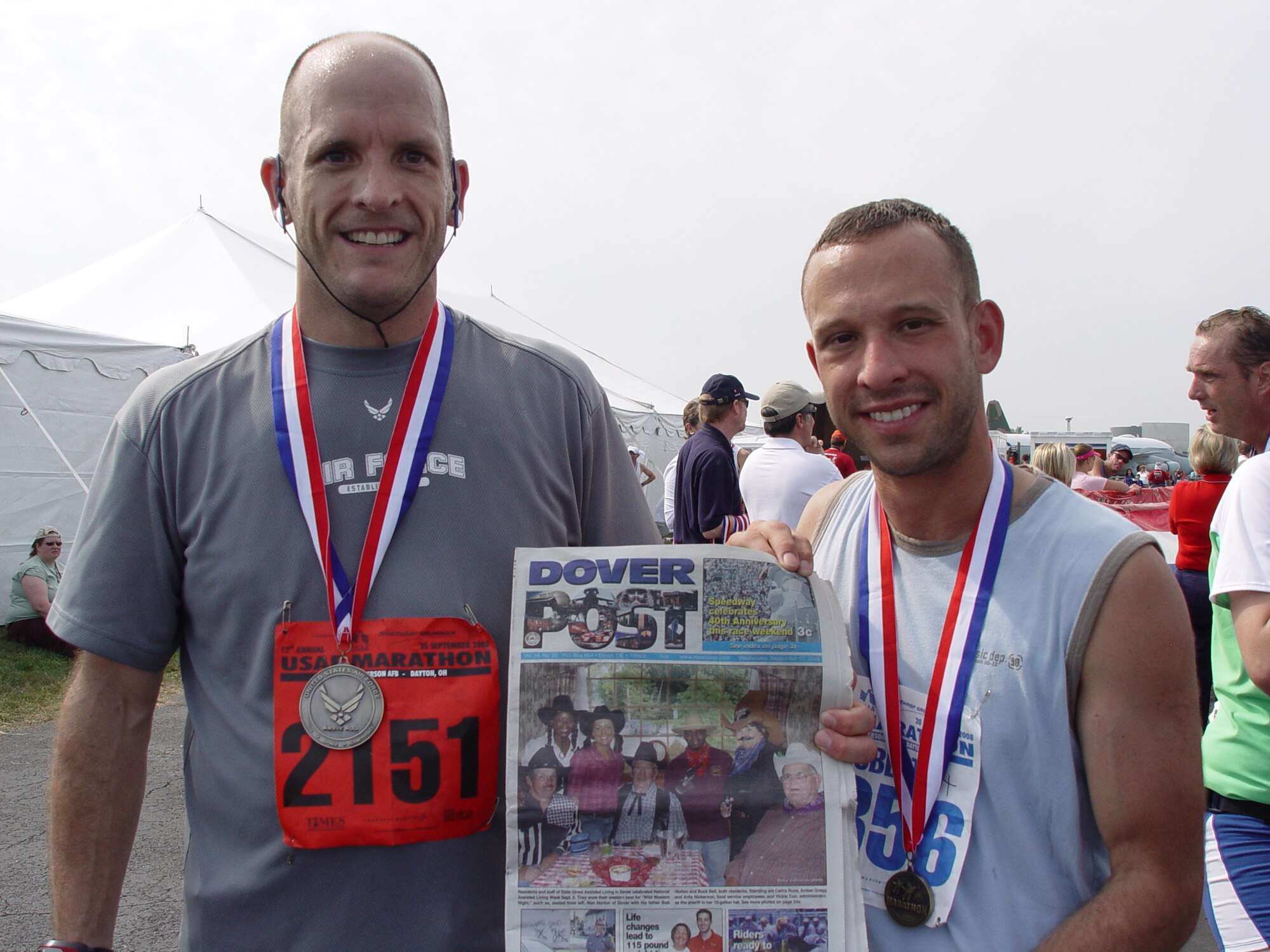 WRIGHT PATTERSON AIR FORCE BASE, Ohio -- (Left to right) Master Sgt. Kevin Murphy, 436th Mission Support Group, and Tech. Sgt. Rob Noffsker, 436th Aerial Port Squadron, take a break after participating in the Air Force Marathon in Dayton, Ohio, Sept. 20. Sergeant Murphy ran the full 26.2 mile marathon and Sergeant Noffsker ran the 6.2 mile run. The following Team Dover members participated in the marathon: Col. Dennis Daley, Staff Sgt. Robert Noffsker, Master Sgt. Juanita Thomas, Airman 1st Class Kelsey Charron, Master Sgt. Kevin Murphy, 1st Lt. James Harris, Tech. Sgt. Eric Smith and Capt. Matthew Humphrey. (Courtesy photo)                          