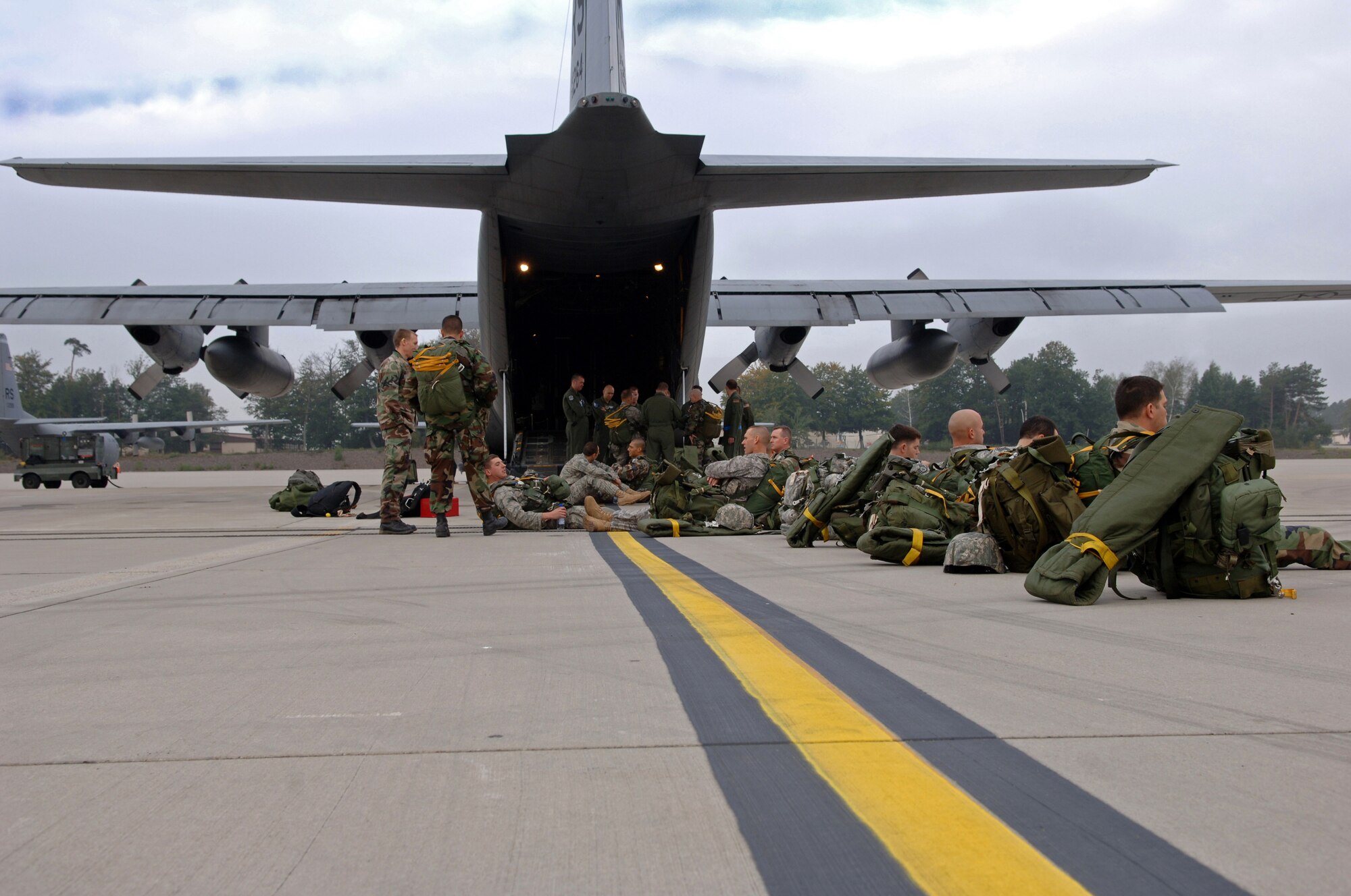 United States Air Force members from the 786th Security Forces Squadron, wait to board a C-130 aircraft during an airborne jump exercise, Ramstein Air Base, Germany,Sept. 24, 2008. The exercise is in preparation for an up-coming mission in Bitburg. (U.S. Air Force photo by Airman 1st Class Tony R. Ritter)(Released)