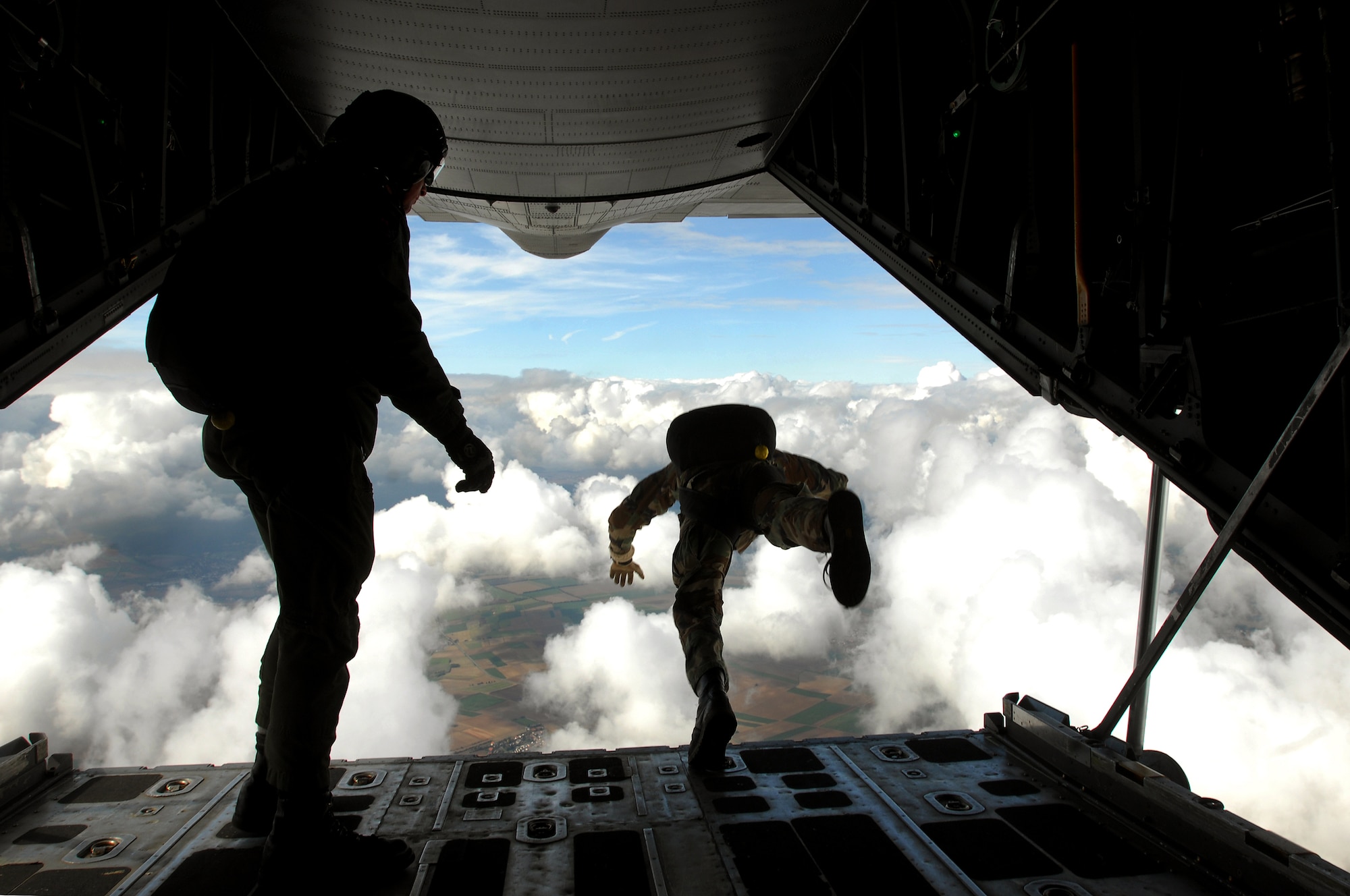 United States Air Force pararescuemen jump out the back of a C-130 over Southwestern Germany, Sept. 24, 2008, in conjunction with the 786th Security Forces Squadron jump training. (U.S. Air Force photo by Airman 1st Class Kenny Holston)(Released)
