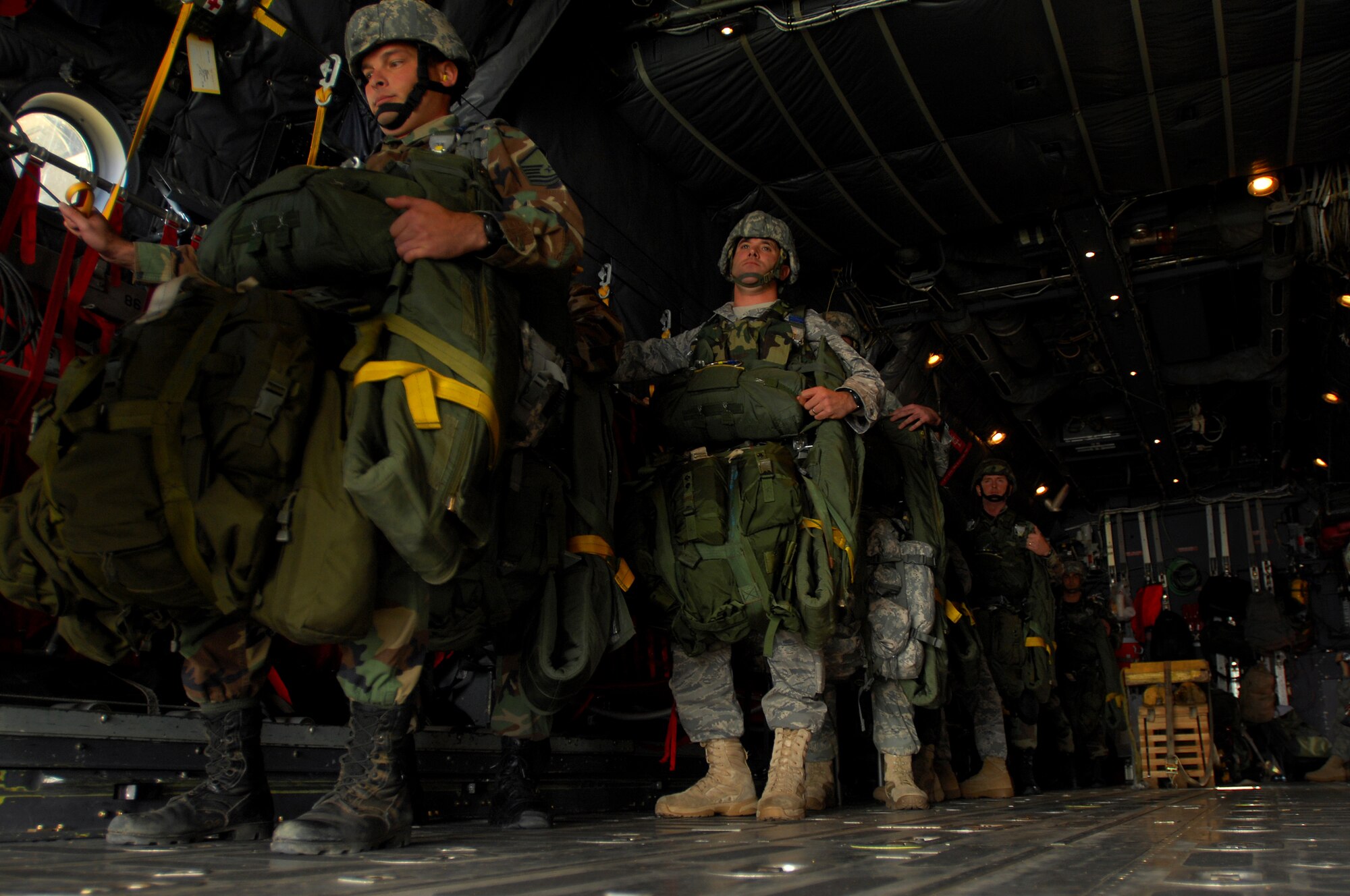 United States Air Force members from the 786th Security Forces Squadron prepare to jump out the back of a C-130 during an airborne jump exercise over Southwestern Germany, Sept. 24, 2008, in preparation for an up-coming mission in Bitburg. (U.S. Air Force photo by Airman 1st Class Kenny Holston)(Released)