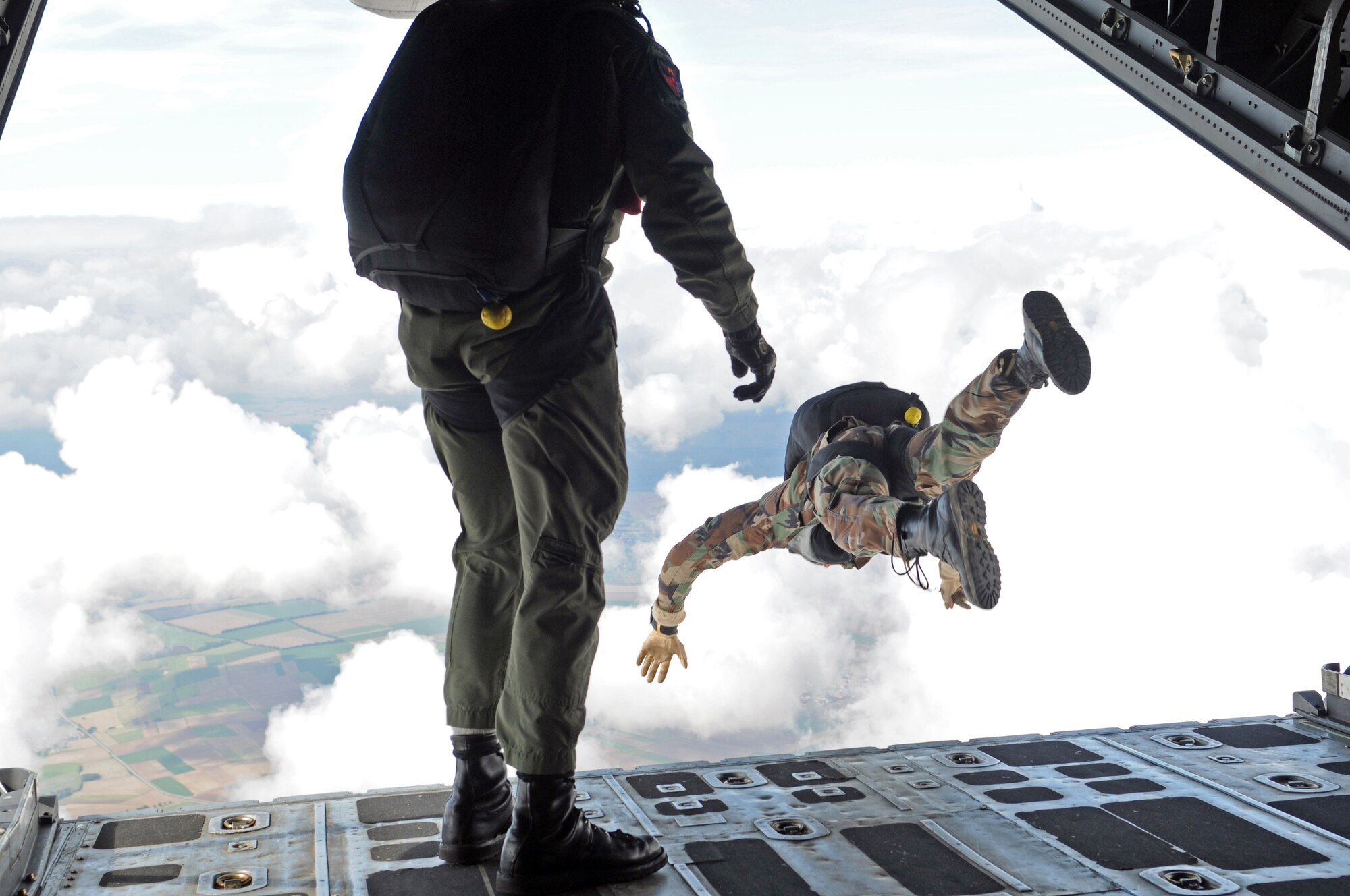United States Air Force pararescuemen go airborne out the back of a C-130 over Southwestern Germany, Sept. 24, 2008, in conjunction with the 786th Security Forces Squadron jump training.(U.S. Air Force photo by Airman 1st Class Grovert Fuentes)(Released)