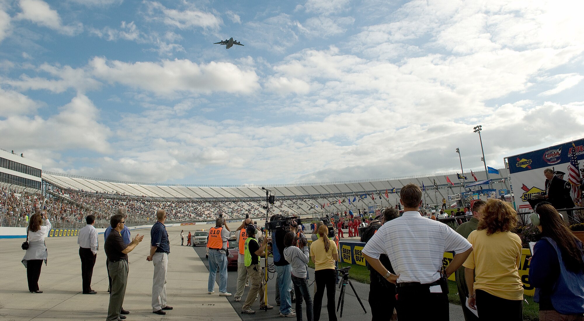 DOVER, Del. -- A C-17 from Dover performs a flyover during the opening ceremonies at the Monster Mile Sept. 19. Twice a year NASCAR comes to Dover and servicemembers from across the state participate in the festivities. Besides providing a flyover, Dover Airmen served food, provided security and presented the colors during several events on 'race weekend.' (U.S. Air Force photo/Jason Minto) 