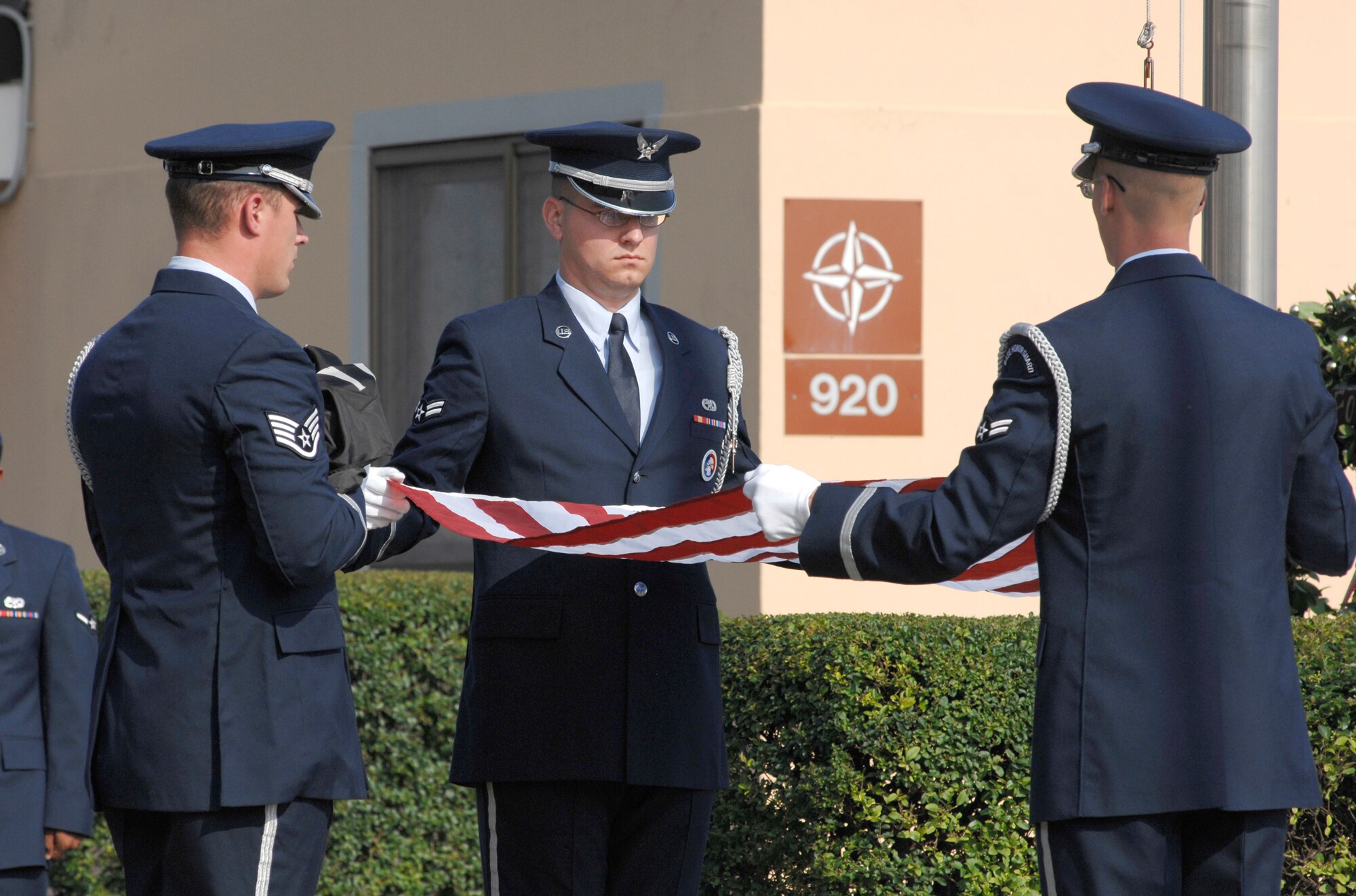 From left to right: Staff Sgt. Bobby McCorkel, Airman 1st Class Adam Splattstoesser and Airman 1st Class Matthew Adolph, 31st Fighter Wing Honor Guardsmen, fold the American Flag during a special retreat ceremony in honor of National POW/MIA Recognition Day. (U.S. Air Force photo/Airman 1st Class Ashley Wood) 