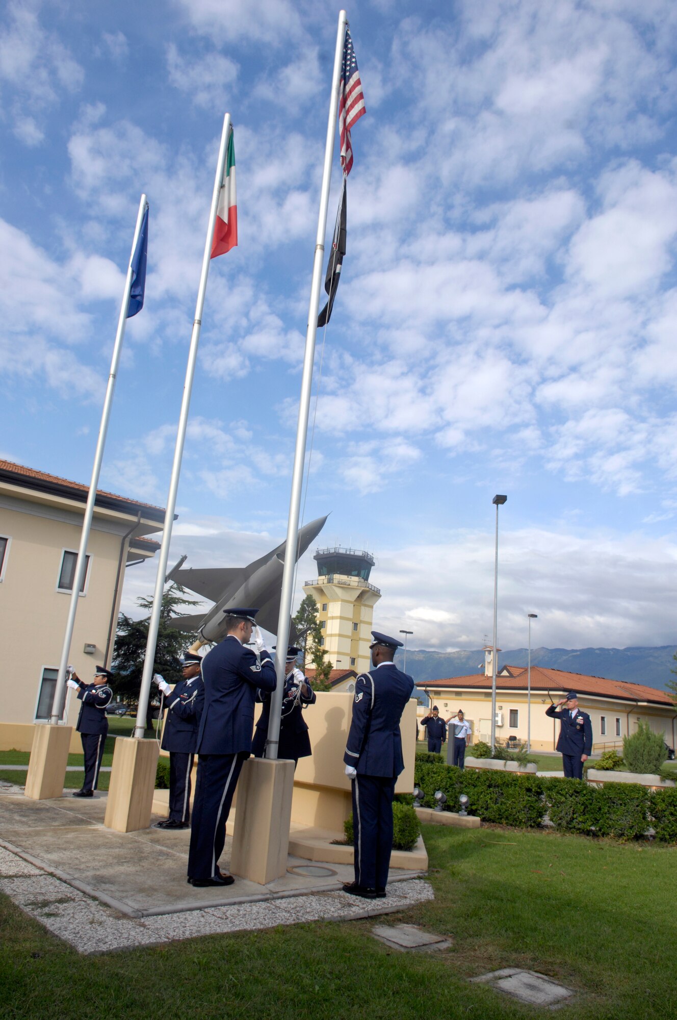 Brig. Gen. Craig Franklin, 31st Fighter Wing commander, salutes the U.S. flag during the base's National POW/MIA Recognition Day Reveille Ceremony. (U.S. Air Force photo/Senior Airman Michael Dorus)