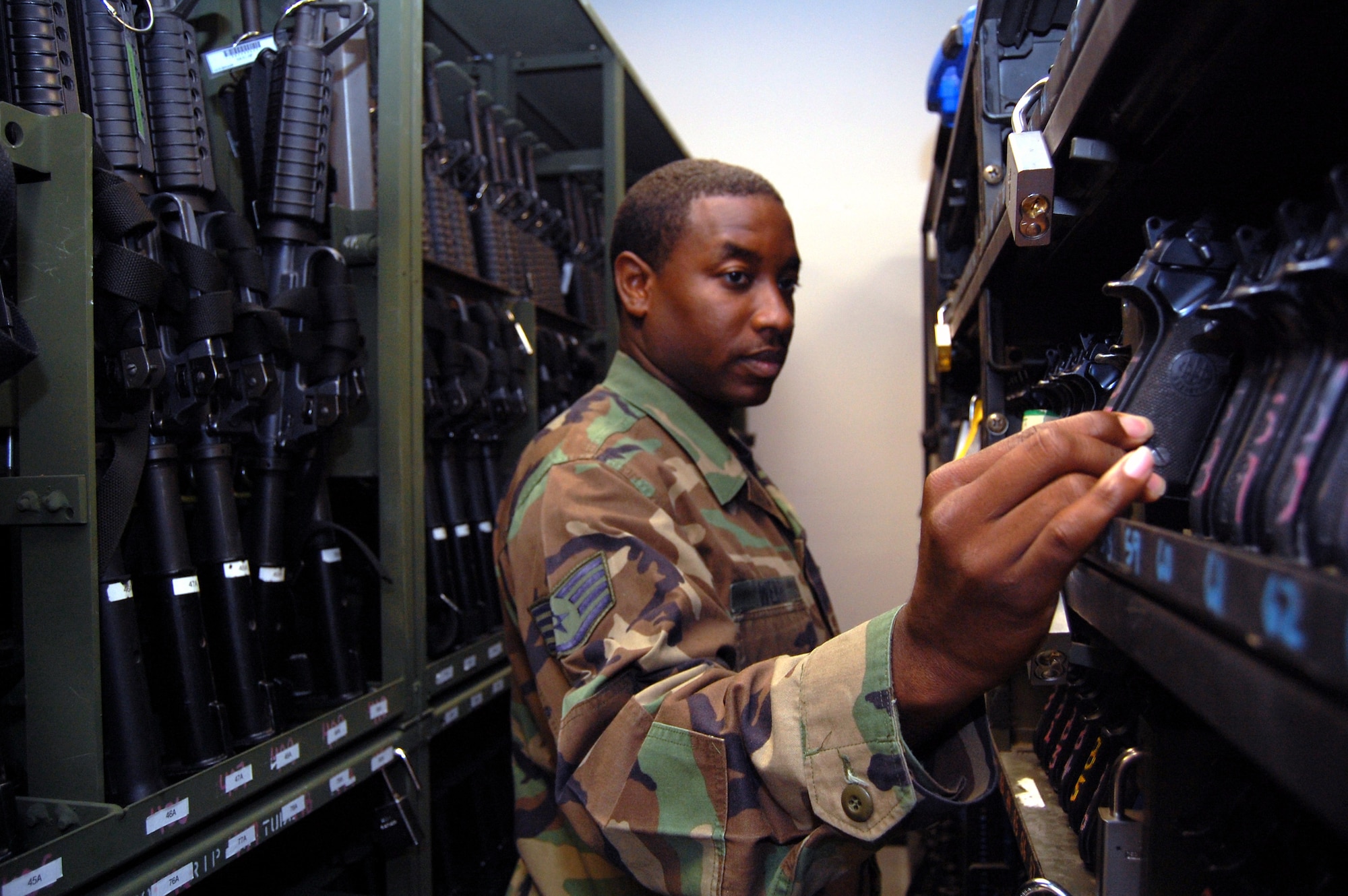 Staff Sgt. Raymar Webb, U.S. Air Force Expeditionary Center combat arms instructor, reviews the inventory of M-9 pistols while working in the armory on Fort Dix, N.J., Sept. 22, 2008.  Sergeant Heraty and three other Airmen manage 48 different weapons systems and 153 different types of foreign weapons in the USAF EC armory -- the most foreign weapons than any armory in the Air Force.  The weapons they care for support more than 7,000 students annually who attend the center's expeditionary courses. (U.S. Air Force Photo/Tech. Sgt. Scott T. Sturkol)