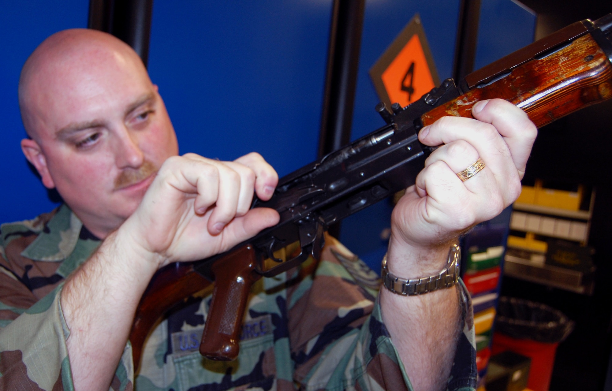 Tech. Sgt. Sean Heraty, U.S. Air Force Expeditionary Center armory assistant noncommissioned officer in charge, inspects an AK-47 while working in the armory on Fort Dix, N.J., Sept. 22, 2008.  Sergeant Heraty and three other Airmen manage 48 different weapons systems and 153 different types of foreign weapons in the USAF EC armory -- the most foreign weapons than any armory in the Air Force.  The weapons they care for support more than 7,000 students annually who attend the center's expeditionary courses. (U.S. Air Force Photo/Tech. Sgt. Scott T. Sturkol)