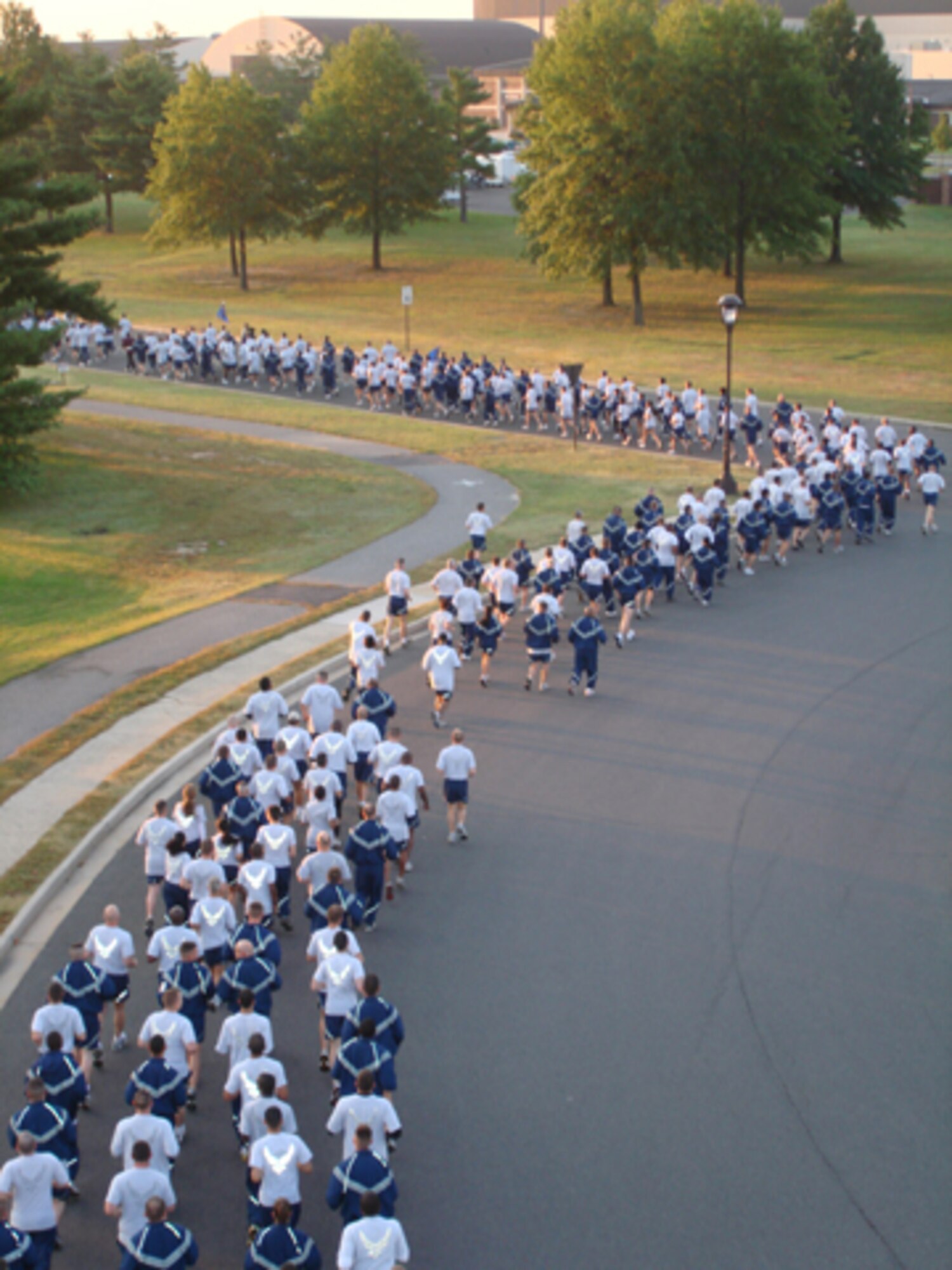 Hundreds of Airmen from across McGuire Air Force Base participate in a Warrior Run that kicked off Sports Day on Sept. 24.  The day started off with the run at 7 a.m. followed by several other events, including basketball, walleyball and a bench-press competition. (U.S. Air Force photo/Staff Sgt. Francis Lalic)                             