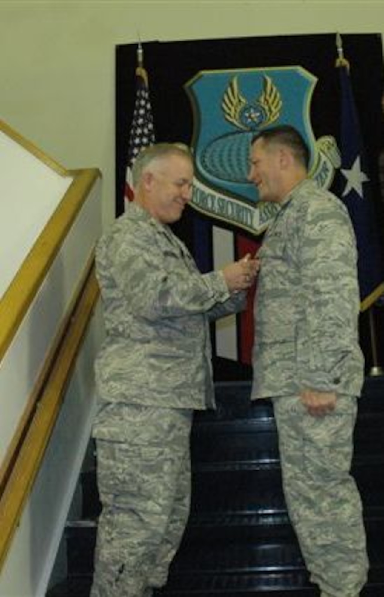 Brig. Gen. Joseph Reheiser, Air Force Security Assistance Center commander, pins the Legion of Merit on Col. Larry Avery, deputy director of the Security Assistance Office for the Multi-National Security Transition Command – Iraq.  Colonel Avery received the award for his tenure as Commander of the 555th International Group. 