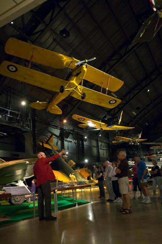 DAYTON, Ohio - Volunteer Jerry Millhouse leads a group through the Early Years Gallery during a Heritage Tour. (U.S. Air Force photo by MSgt. Cecilio Ricardo)