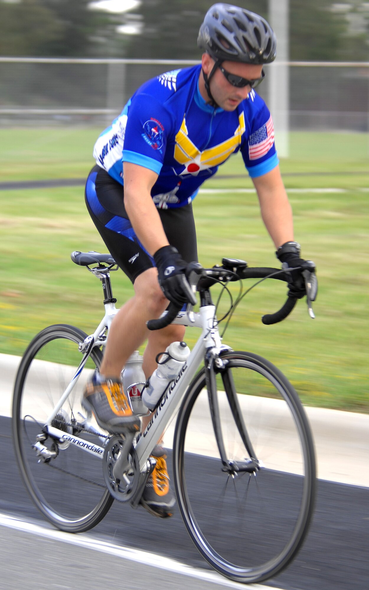A competitor in the Sprint Triathlon held on Seymour Johnson Air Force Base, N.C., begins the biking portion, Sep. 20. The triathlon consisted of a 400 meter swim, a 15 mile bike ride and a four mile run. (U.S. Air Force photo by Airman 1st Class Makenzie Lang)

