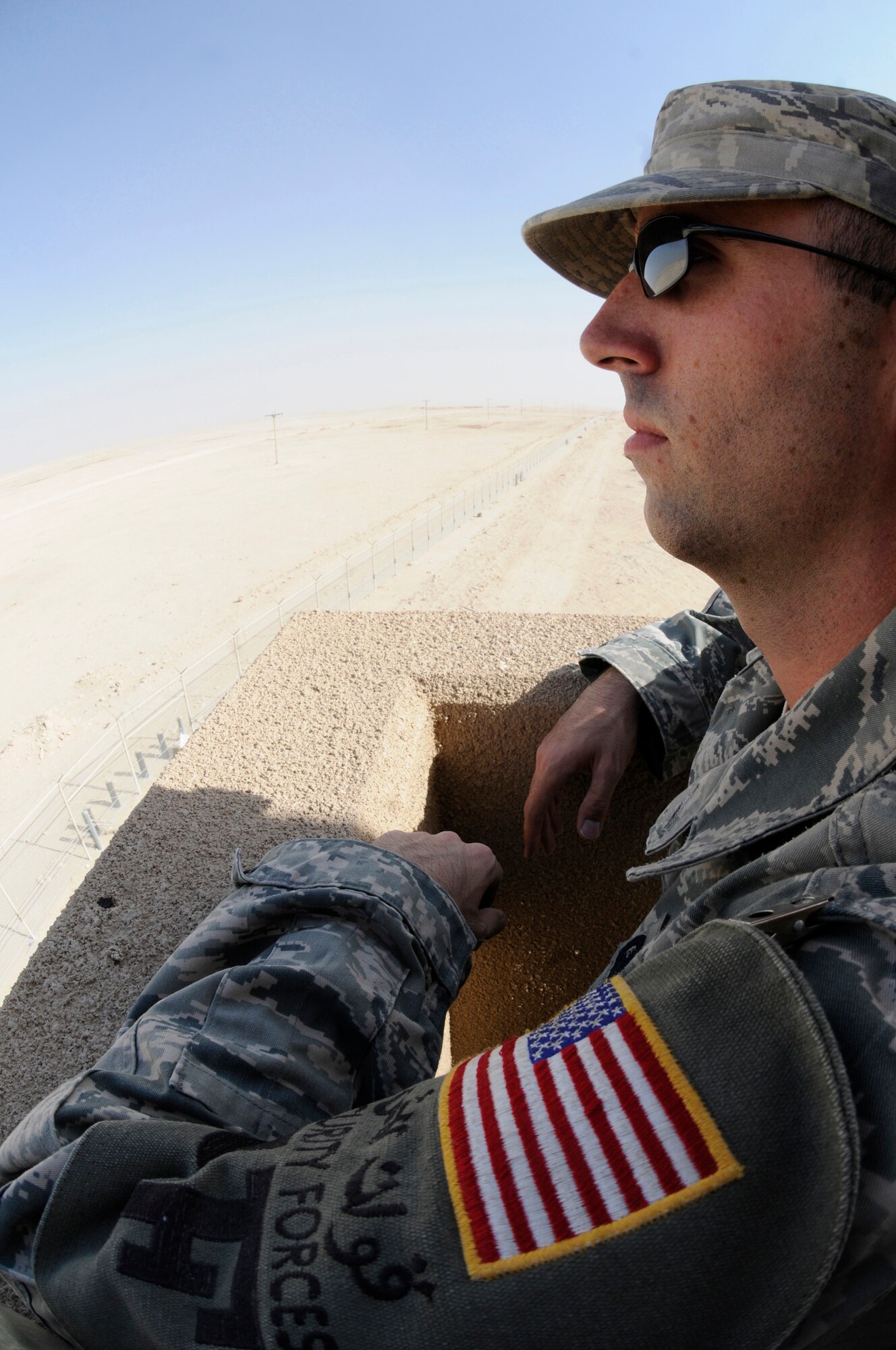 Staff Sgt. Benjamin Thomas, patrolman assigned to the 379th Expeditionary Security Forces Squadron, watches the base perimeter for suspicious activities Sept. 24, 2008, at an undisclosed air base in Southwest Asia. Patrolmen assigned to the ESFS ensure the safety and security of resources and personnel assigned here supporting Operations Iraqi Freedom, Enduring Freedom and Joint Task Force-Horn of Africa. Sergeant Thomas, a native of Mehoopany, Pa., is deployed from Keesler Air Force Base, Miss. (U.S. Air Force photo by Staff Sgt. Darnell T. Cannady/Released)
