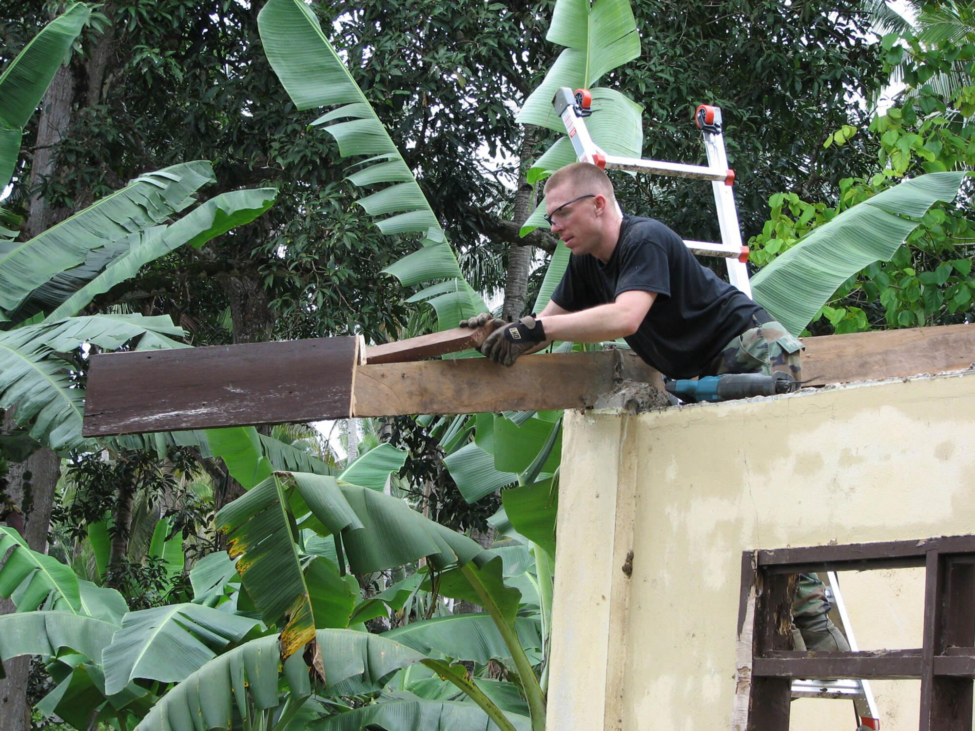 TAWI-TAWI, Philippine -- Staff Sgt. Jessie Gent, 35th Civil Engineer Squadron engineer, installs roof trusses in the Philippine province of Tawi-Tawi, during Balikatan '08 Feb. 14, 2008. The term Balikatan is a Tagalog word which means "shouldering the load together," which characterizes the philosophy and intent of the exercise. Sergeant Gent, along with other Misawa engineers, worked with PI engineers to renovate an elementary school in Tawi-Tawi. (U.S. Air Force courtesy photo) 
