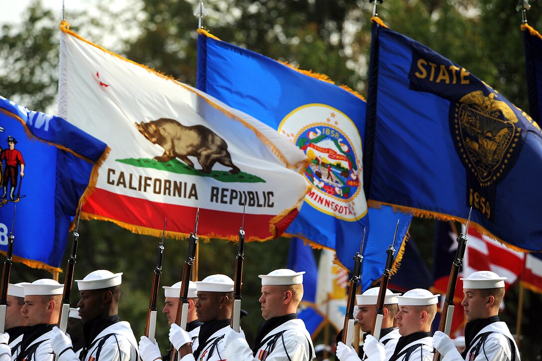 A joint color guard carrying the flags from all 50 states marches onto the field during a military parade in honor of retiring U.S. Sens. John Warner and Duncan Hunter at Whipple Field on Fort Myer, Va., Sept. 24, 2008.