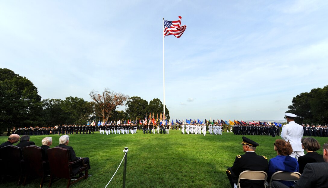 A formation of Marines, soldiers, sailors, airmen, and Coast Guardsmen take the field during a military parade in honor of retiring U.S. Sens. John Warner and Duncan Hunter at Whipple Field on Fort Myer, Va., Sept. 24, 2008.