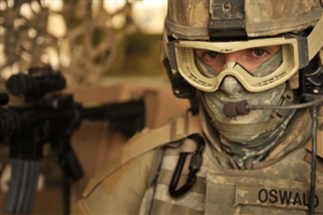 U.S. Air Force Airman 1st Class Travis Oswald, 332nd Expeditionary Security Force, Immediate Reaction Force, prepares for a patrol at Joint Base Balad, Iraq, on Sept. 24, 2008.  