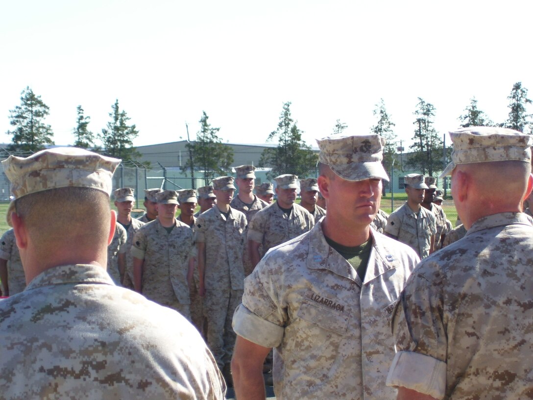Capt. Joseph Lizarraga, Inspector/Instructor, Battery G, 3rd Battalion, 14th Marines, stands before Lt. Col. Rob Roberson, Commanding Officer, 3rd Battalion, 14th Marines, as the citation is read for Lizarraga’s Bronze Star. Lizarraga earned the Bronze Star for meritorious achievement while on a seven month deployment to Iraq. During that time, Lizarraga lead 80 Marines from the Trenton, N.J., area in detainee operations for a regional detention facility.