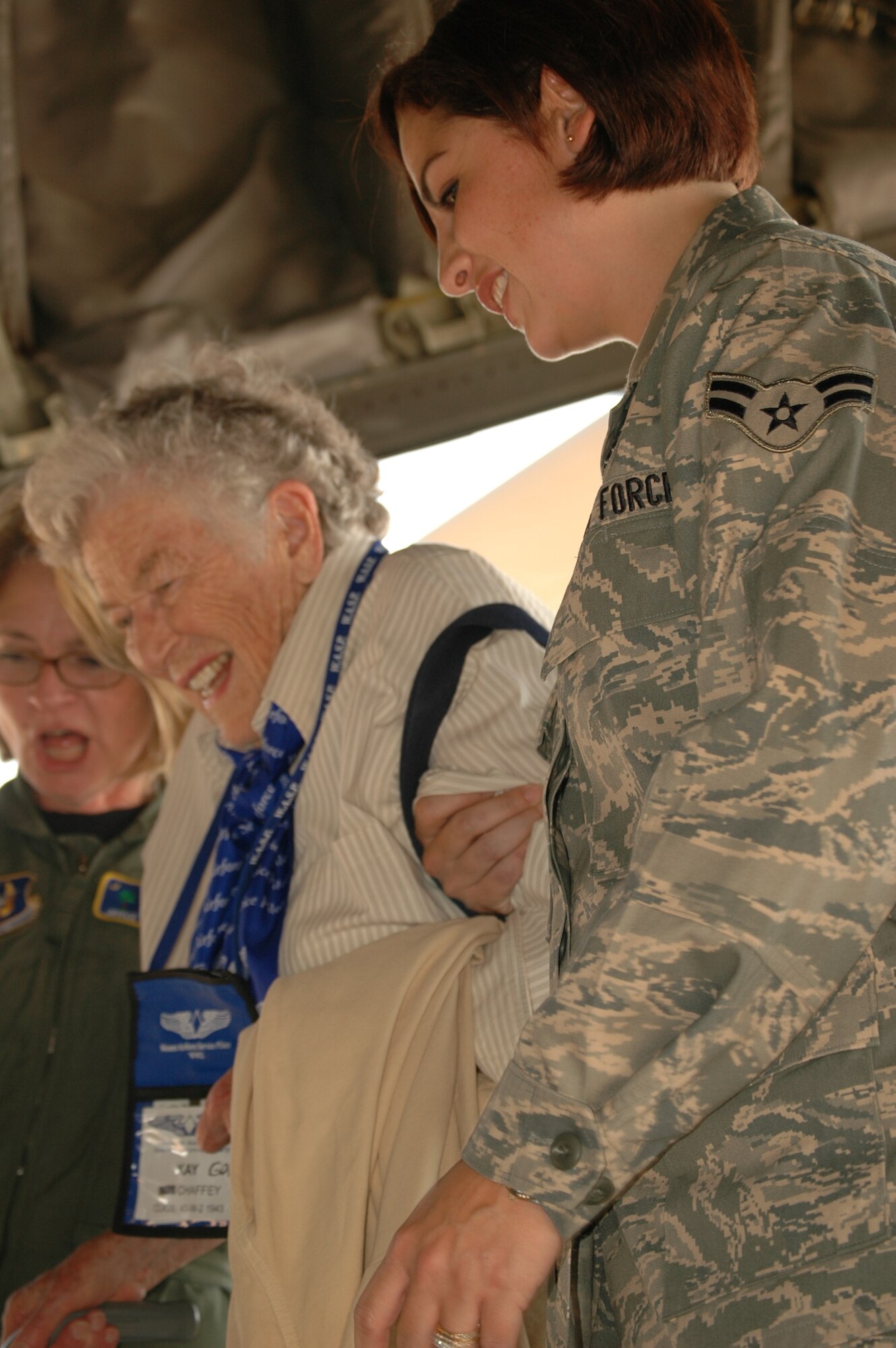 Airman First Class Veronica Natal, a Reserve Air Transportation Specialist with the 25th Aerial Port Squadron, of the 908th Airlift Wing, Maxwell Air Force Base escorts Kay Gott Chaffey, onto a 302nd Airlift Wing C-130 for the Women Airforce Service Pilot's last flight in a military aircraft at Love Field, Texas on September 25.  Chaffey ferried aircraft and flew fighters with the Air Transport Command’s 5th Ferrying Group during WW II.