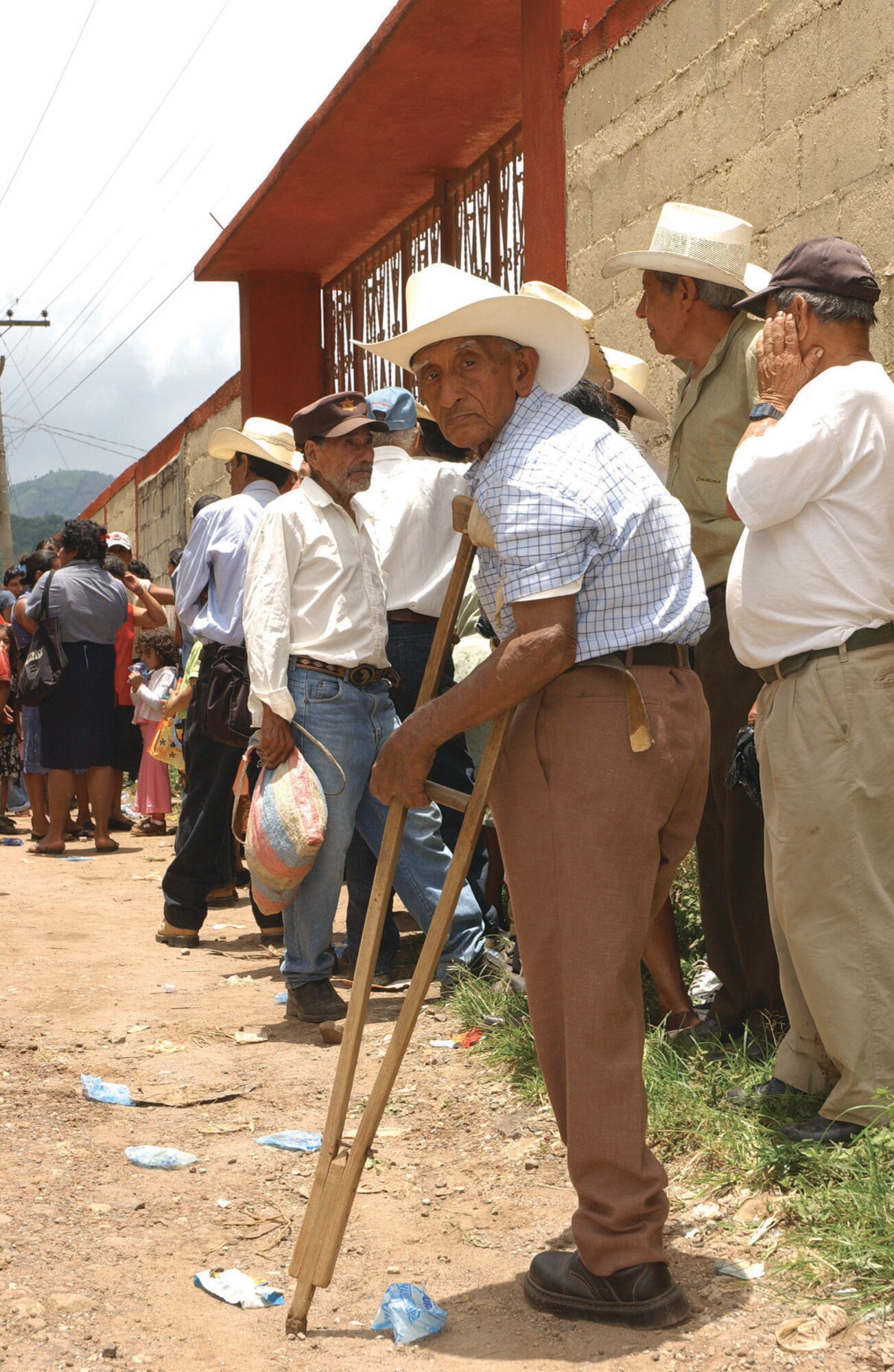 A line of Guatemalan citizens waits outside a school near Santa Rosa to be seen by members of the 163d Medical Group. Thirty-one members of the group traveled to Guatemala Aug. 16-30 to participate in a U.S. Air Forces South-sponsored Medical Readiness Training Exercise where they provided medical care for more than 5,700 people in three of the poorest communities in Santa Rosa. (U.S. Air Force photo by Capt Al Bosco, 163RW/PA)