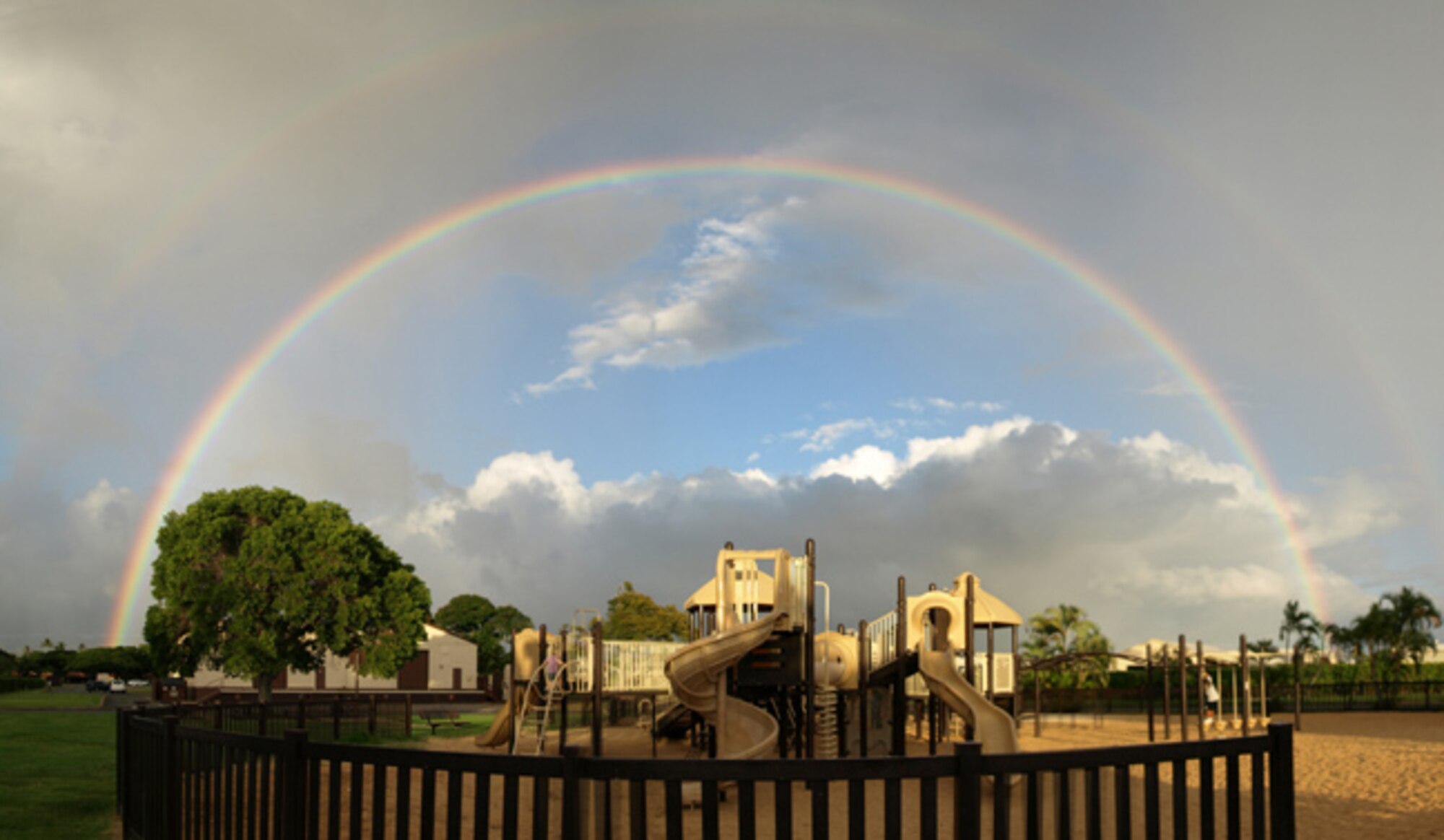 With the fall of rains come some of Hawaii’s most breathtaking moments, like this one at a Hickam playground.  (U.S. Air Force Photo/Master Sgt. Peter A. Rolfe) 
