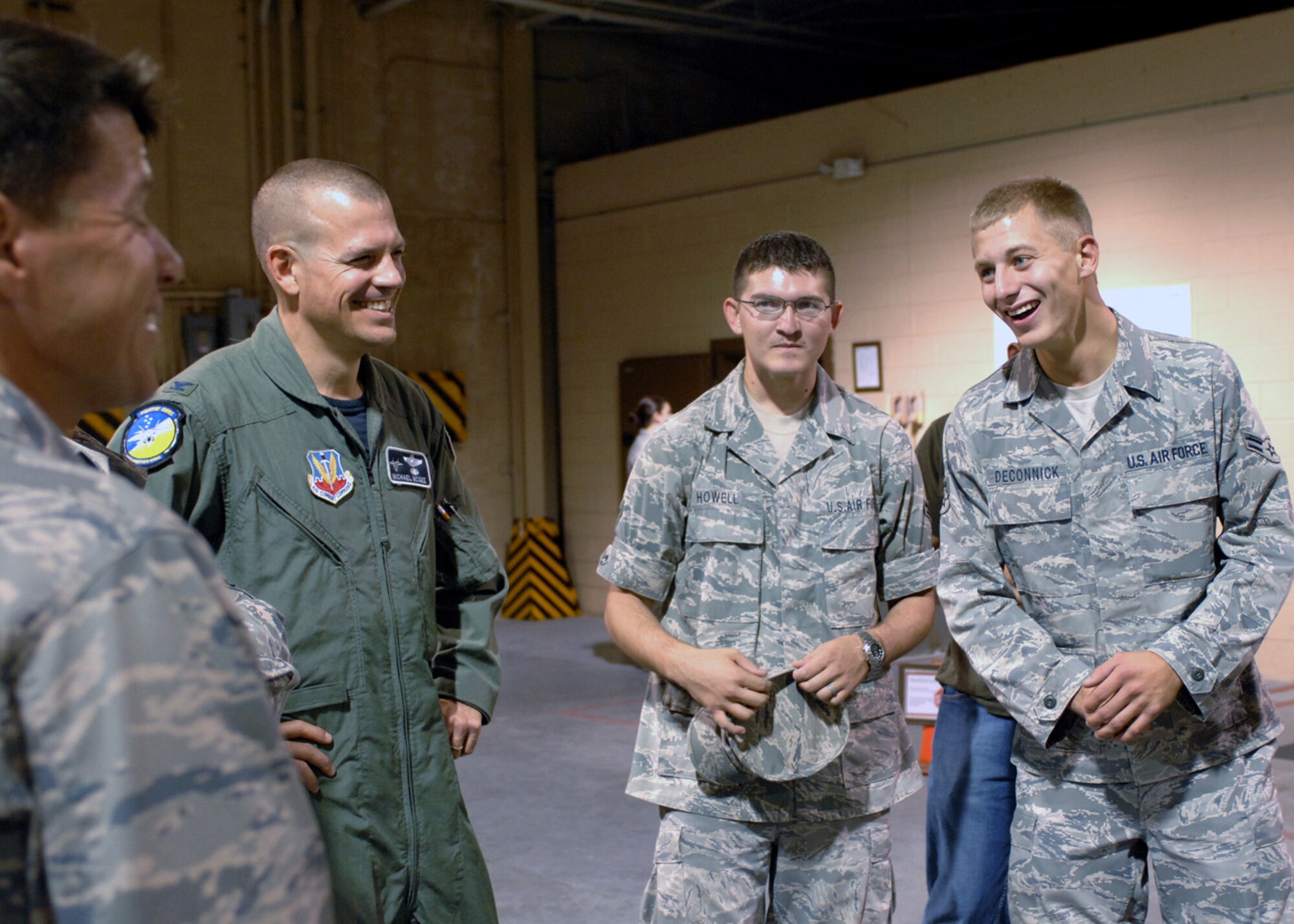 Col. Michael McGee, 49th Fighter Wing vice commander, welcomes home the 49th Materiel Maintenance Squadron Airmen in the weapons vault at Holloman Air Force Base, N.M., September 23, after returning home from a four-month deployment. All the returning warriors worked force protection during their deployment to Kirkuk Air Force Base, Iraq. (U.S. Air Force photo/Airman 1st Class Veronica Salgado)